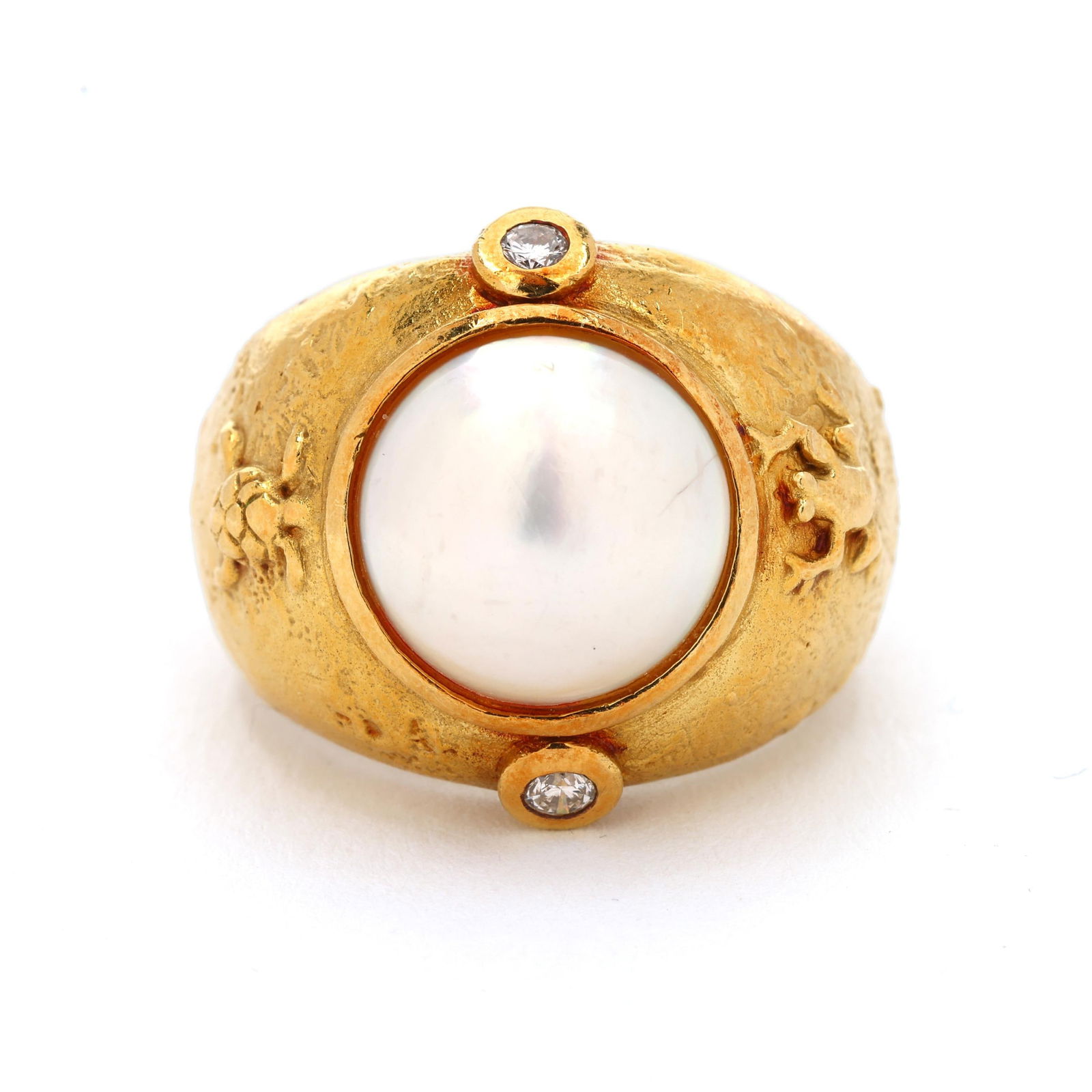 Gold, Mabé Pearl, and Diamond Ring, SeidenGang: Gold, Mabé Pearl, and Diamond Ring, SeidenGangcentered on a bezel set round mabé pearl (11.2mm) within a textured surround with sea turtle and frog in relief, collet set with two full cut round diam