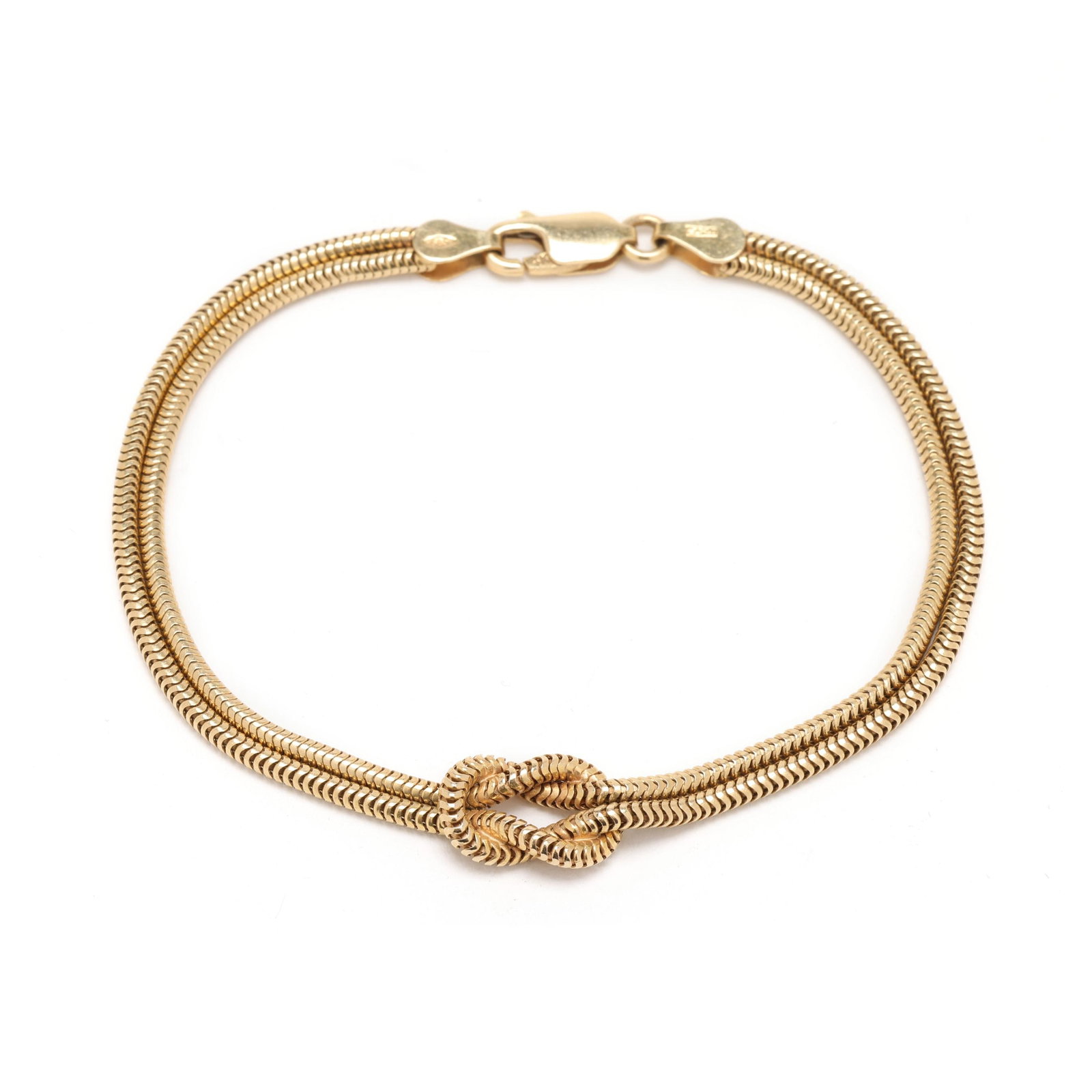 Gold Snake Chain Knot Bracelet, Italy: Gold Snake Chain Knot Bracelet, Italythe gold double snake chain bracelet with square knot to center, completed with a lobster clasp, stamped with a partial mark and 585 / Italy / JMP. 4mm x 7 3/8 in.