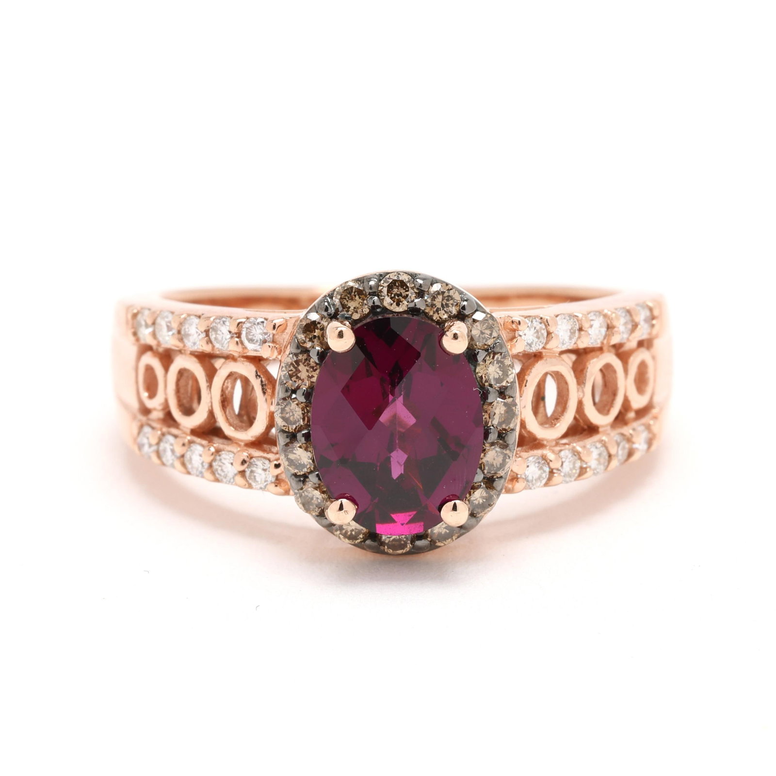 Rose Gold, Rhodolite Garnet, and Diamond Ring, LeVian: Rose Gold, Rhodolite Garnet, and Diamond Ring, LeVian centered on an oval checkerboard cut rhodolite garnet (8.1 x 6.3mm) within a surround of fancy brown color full cut round diamond melee, and set