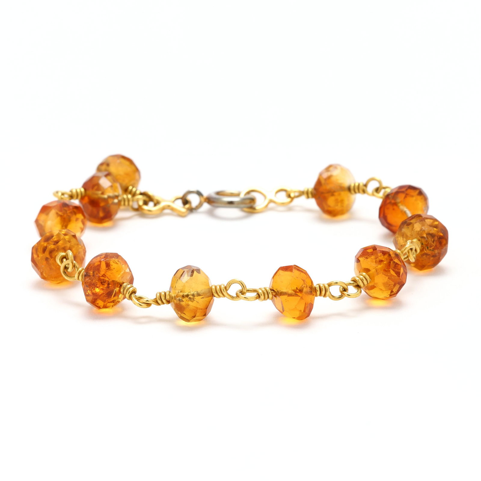 Gold and Citrine Beaded Bracelet: Gold and Citrine Beaded Braceletfaceted citrine stations on gold wire, completed with a silver-tone spring ring clasp, gold wire XRF testing 18KT. 7 in. 7.9 dwt. From the Collection of Francine Pillof