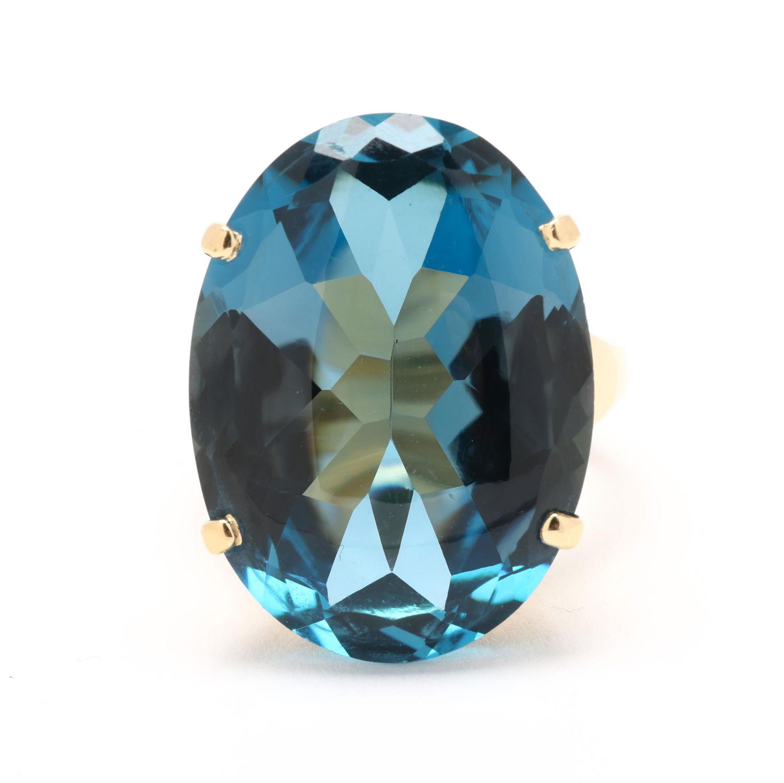 Gold and Blue Tourmaline Ring: Gold and Blue Tourmaline Ringcentered on an oval cut buff top blue tourmaline (23 x 17 x 9.4mm), prong set on a tapering shank, stamped 750 and with maker's mark HH. Ring size 5.75 8.7 dwt. Tourmaline