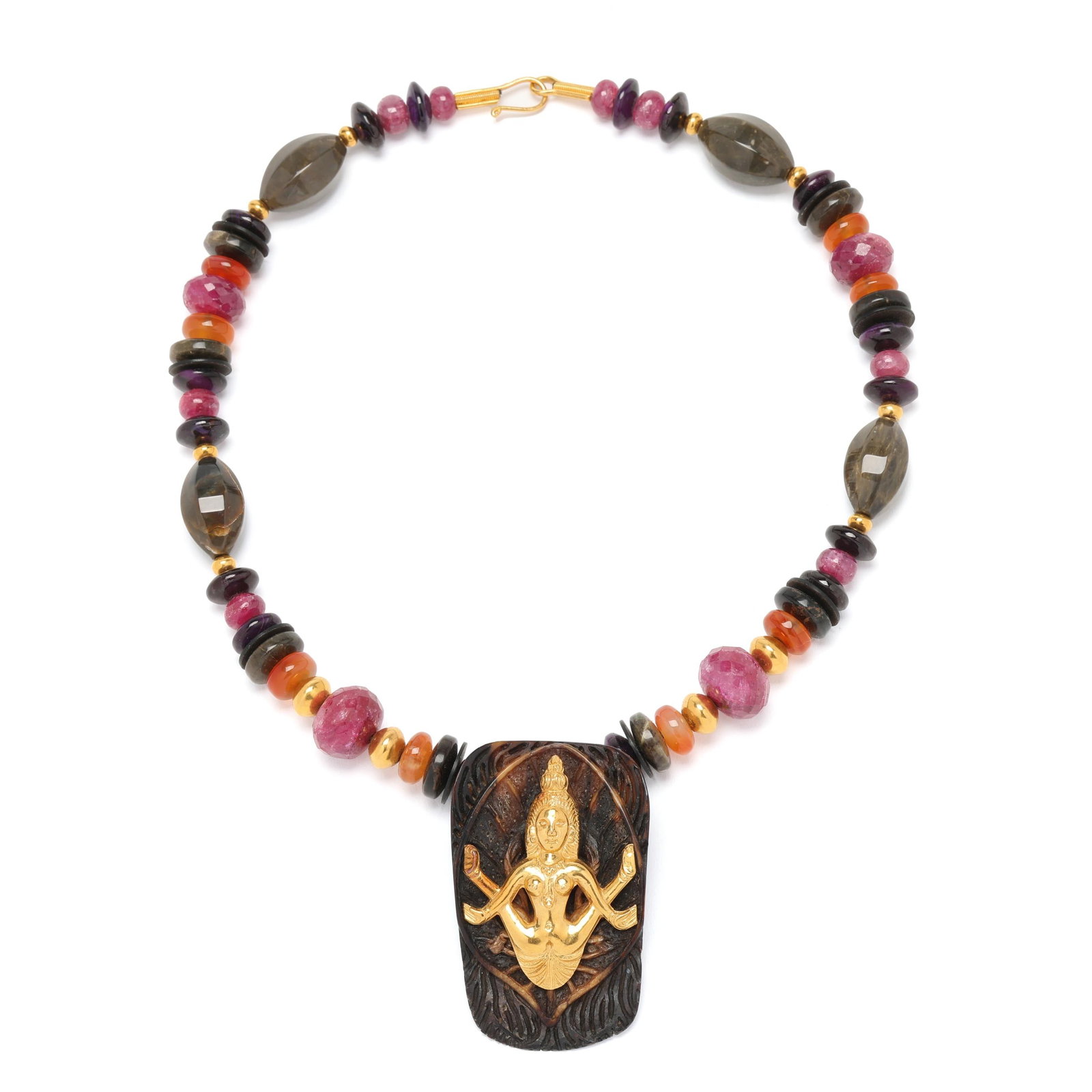 Gold and Gem-Set Ma Maha Shakti Necklace, Shunyata: Gold and Gem-Set Ma Maha Shakti Necklace, Shunyata the carved fossil pendant set with a gold Maha Shakti, suspended from a gem-set necklace to include: ruby, carnelian, agate, sugilite, coconut