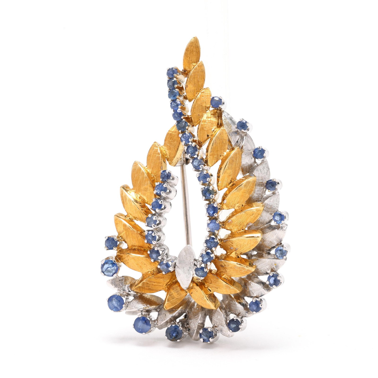 Bi-Color Gold and Sapphire Feather Motif Brooch: Bi-Color Gold and Sapphire Feather Motif Broochwith textured gold and white gold feathers, set with round cut sapphires weighing approximately 1.5 total carats, completed with a single locking pin ste