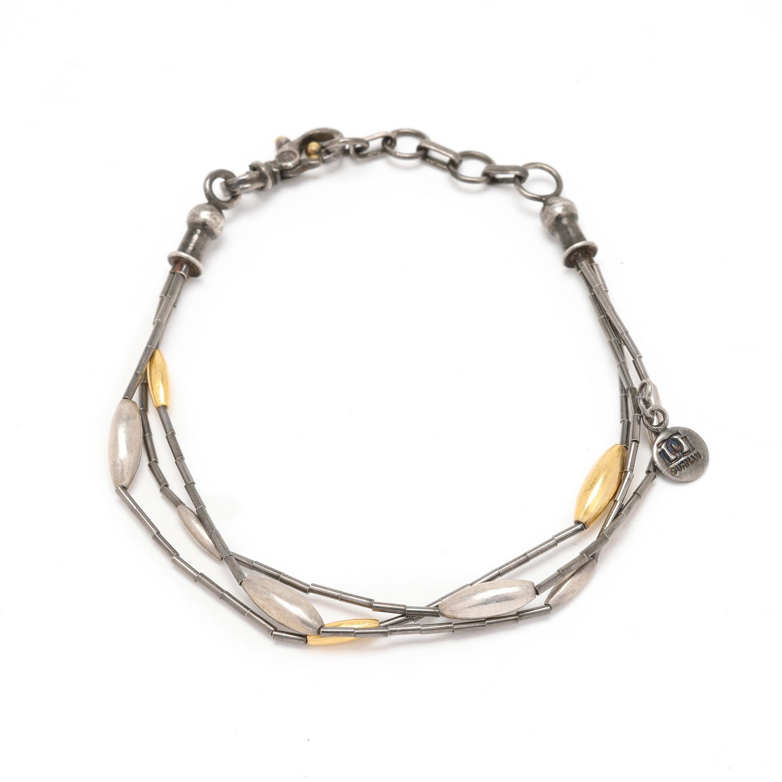 Silver and Gold Multi-Strand Bracelet, Gurhan: Silver and Gold Multi-Strand Bracelet, Gurhanthe oxidized silver multi-strand bracelet with silver and gold plated beads, completed with a signed lobster clasp, suspending a signed tag stamped BT 348