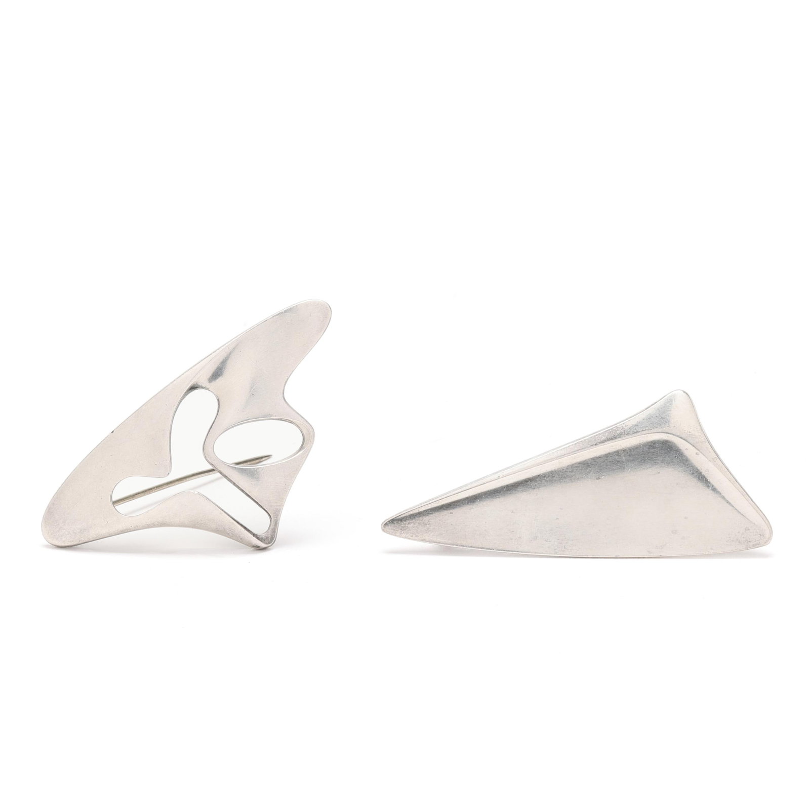 Two Sterling Silver Modernist Brooches, Georg Jensen: Two Sterling Silver Modernist Brooches, Georg Jensento include: one silver modernist brooch in the form of a sail, completed with a locking pin stem, signed and stamped Sterling / Denmark / 327 (1 1/8