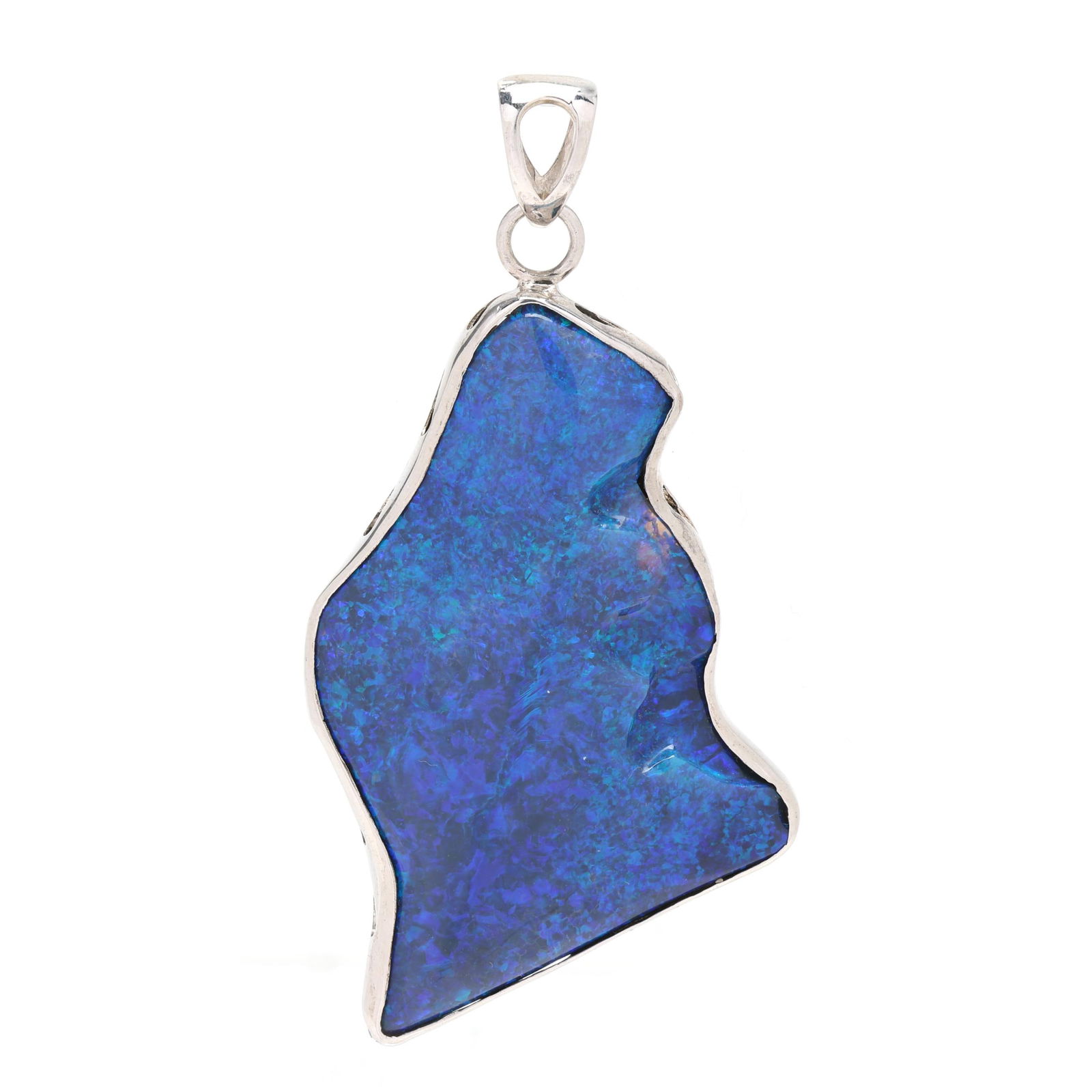 Silver and Black Opal Pendant: Silver and Black Opal Pendant freeform black opal set in a silver frame, completed with a bail, stamped 925. 3.25 x 1 5/8 in. 1.09 troy oz. Estate of the Late Gaye Poteet Evans, Austin, Texas,