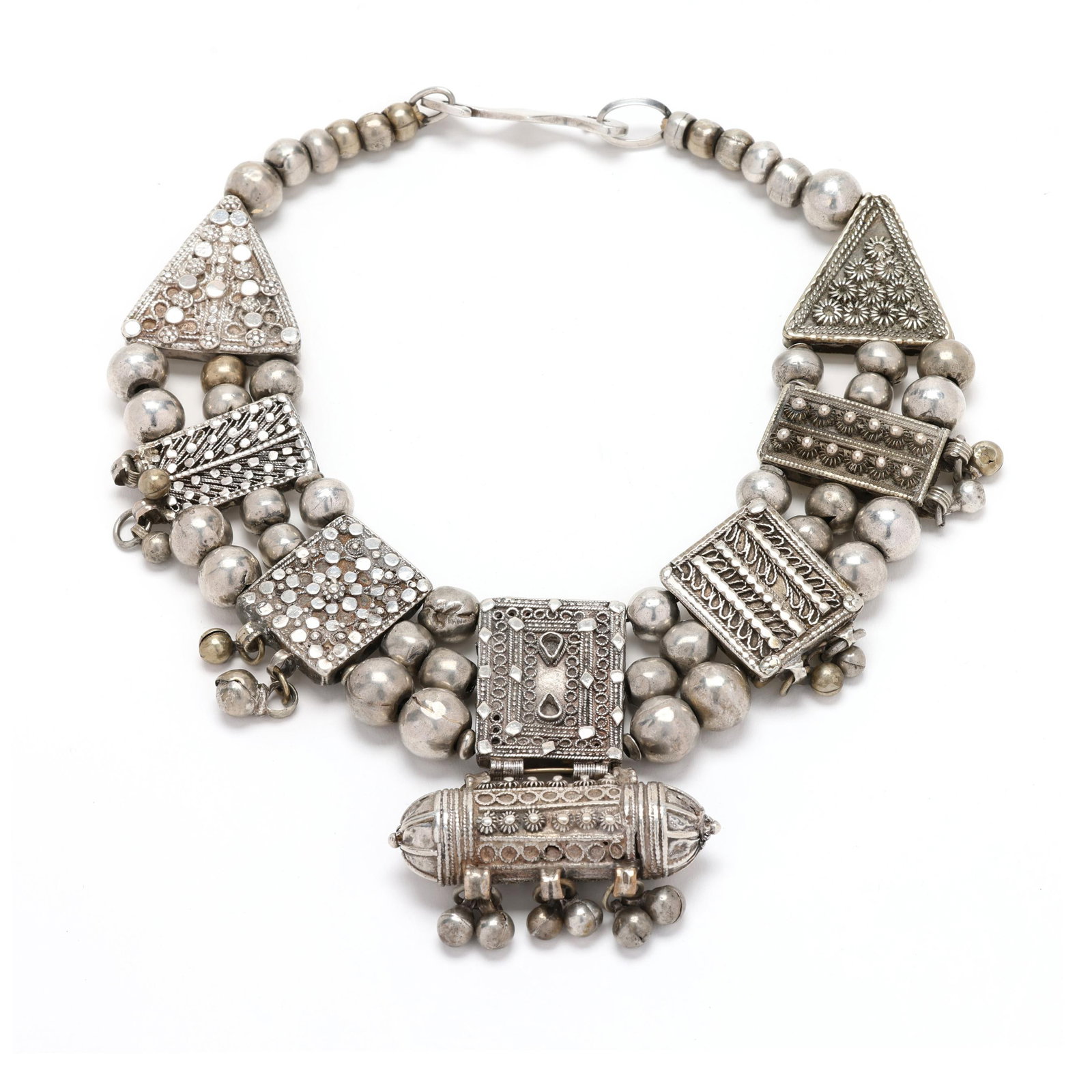 Silver Tribal Style Necklace, Zamani: Silver Tribal Style Necklace, Zamani the silver beaded necklace with decorated geometric stations suspending silver beads, with the center station suspending a cylindrical drop further suspending