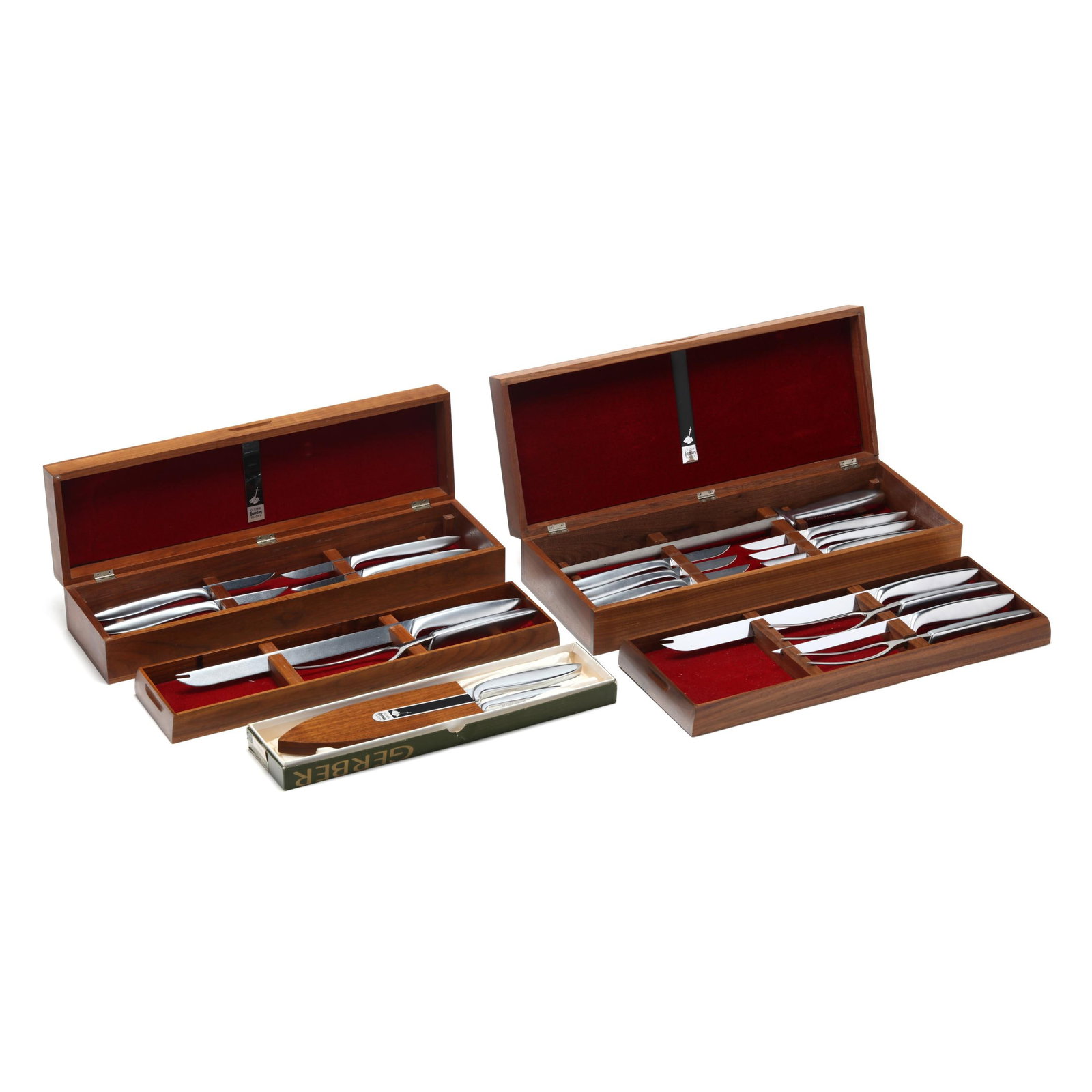 Gerber Legendary Blades, Three Boxed Sets of Knives and Carving Utensils: Gerber Legendary Blades, Three Boxed Sets of Knives and Carving Utensils Oregon, mid-20th century, stainless steel blades with cast aluminum handles, the first set of (2) presented with walnut wall