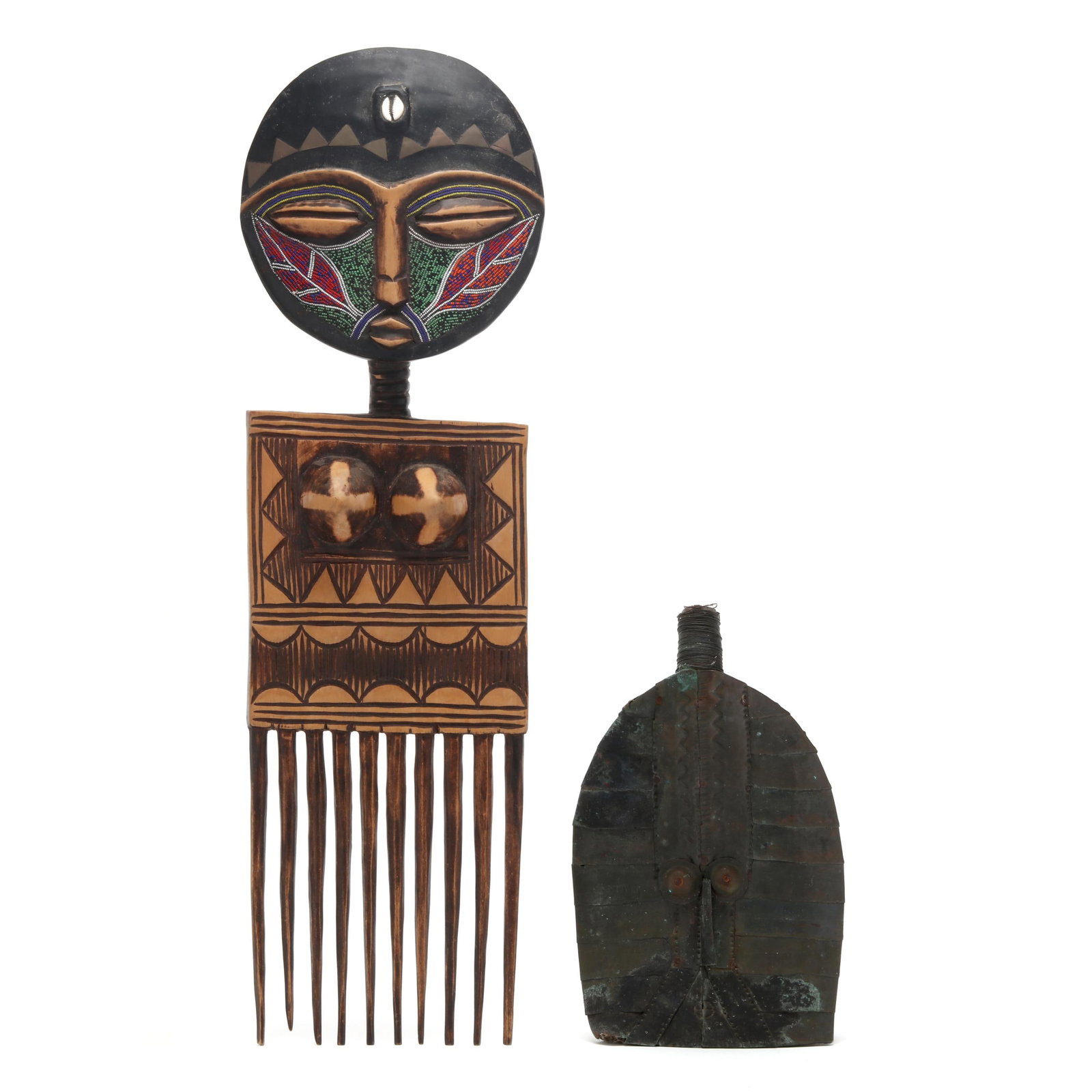 Two West African Objects: Two West African Objects mid- to late 20th century, the first a Kota Mahongwe (Republic of Congo) bwete reliquary guardian figure, mixed metal wrapping carved wood core, meant to be placed on top of