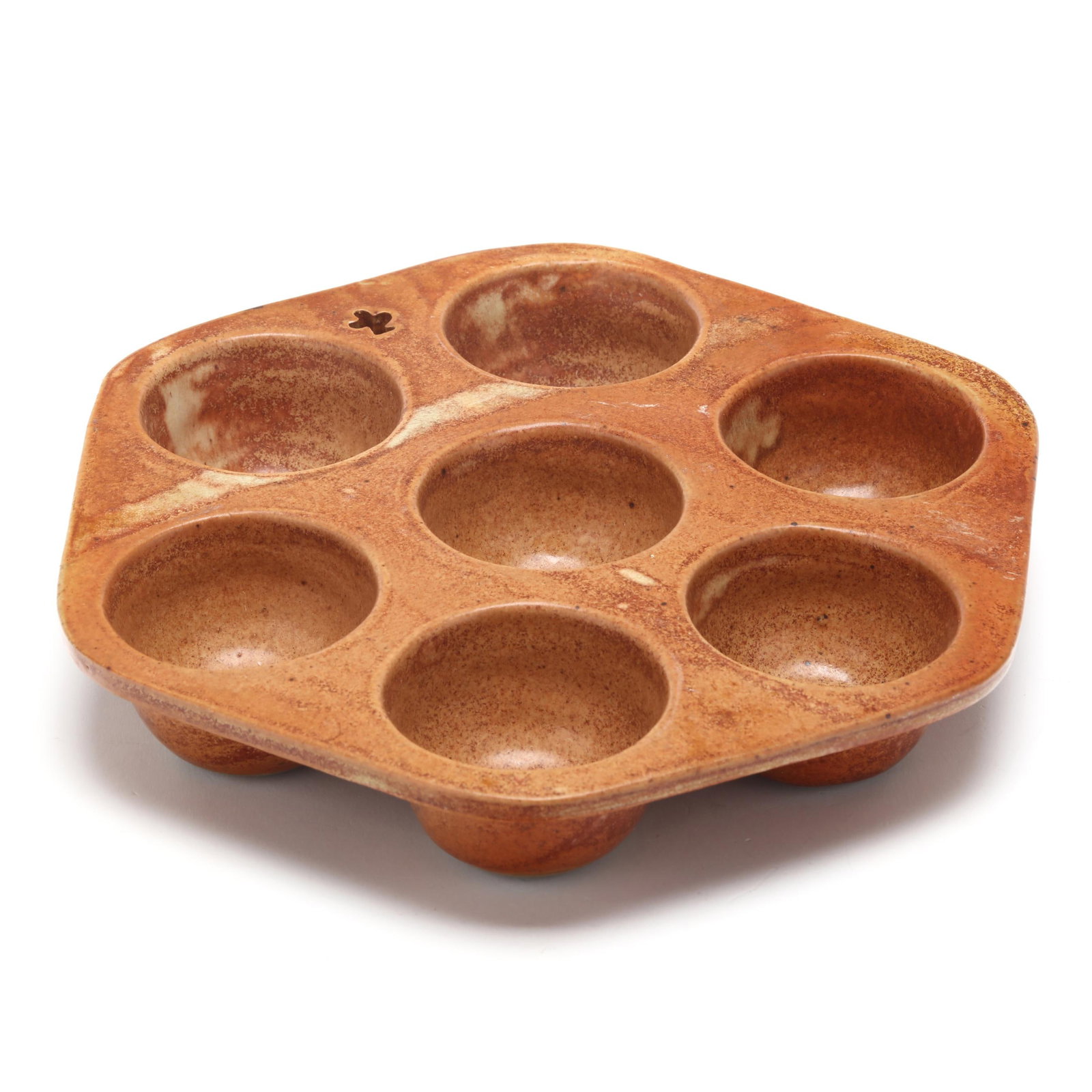 Barking Spider (Bakersville, NC), Pottery Muffin Pan: Barking Spider (Bakersville, NC), Pottery Muffin Pan style no longer in production, orange/yellow glazed stoneware hexagonal muffin pan, pierced form to edge of rim, with impressed "BSP" stamp to