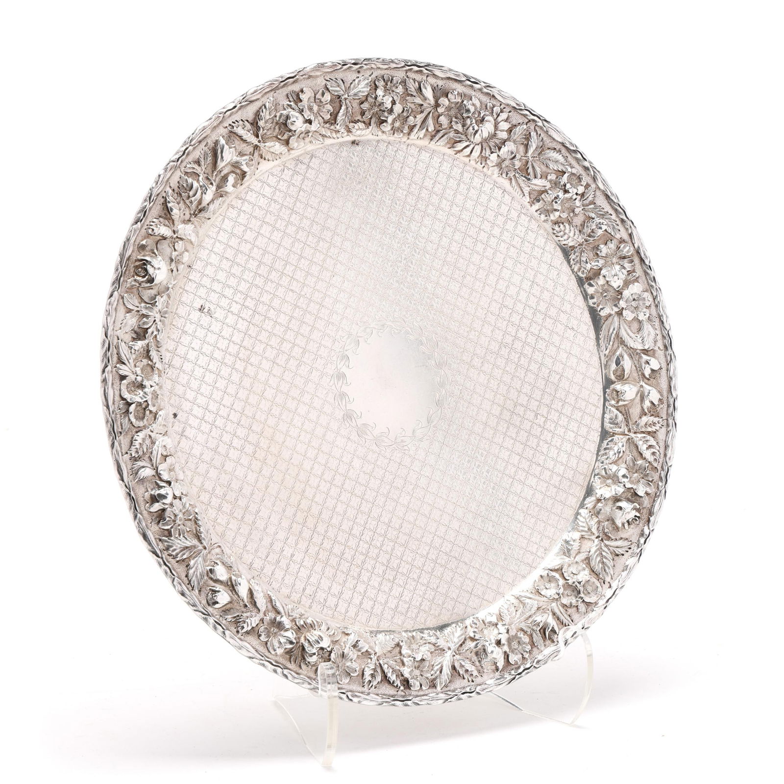 S. Kirk & Son Inc. Repousse Sterling Silver Serving Tray: S. Kirk & Son Inc. Repousse Sterling Silver Serving Tray20th century, pattern 2312, featuring a cross-hatched engraved well and repousse rim with leaf border, not monogrammed. 12 in. dia. 24.5 troy oz