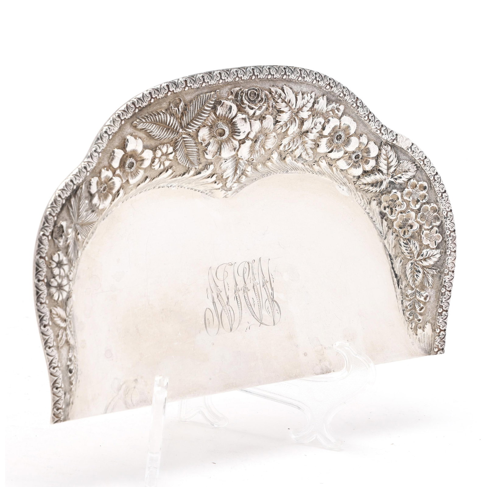 Jacobi & Jenkins Repousse Sterling Silver Crumber: Jacobi & Jenkins Repousse Sterling Silver CrumberBaltimore, 20th century, comb shape with hand-chased floral and leaf decoration against a stippled ground, and a shaped acanthus leaf rim, monogrammed.