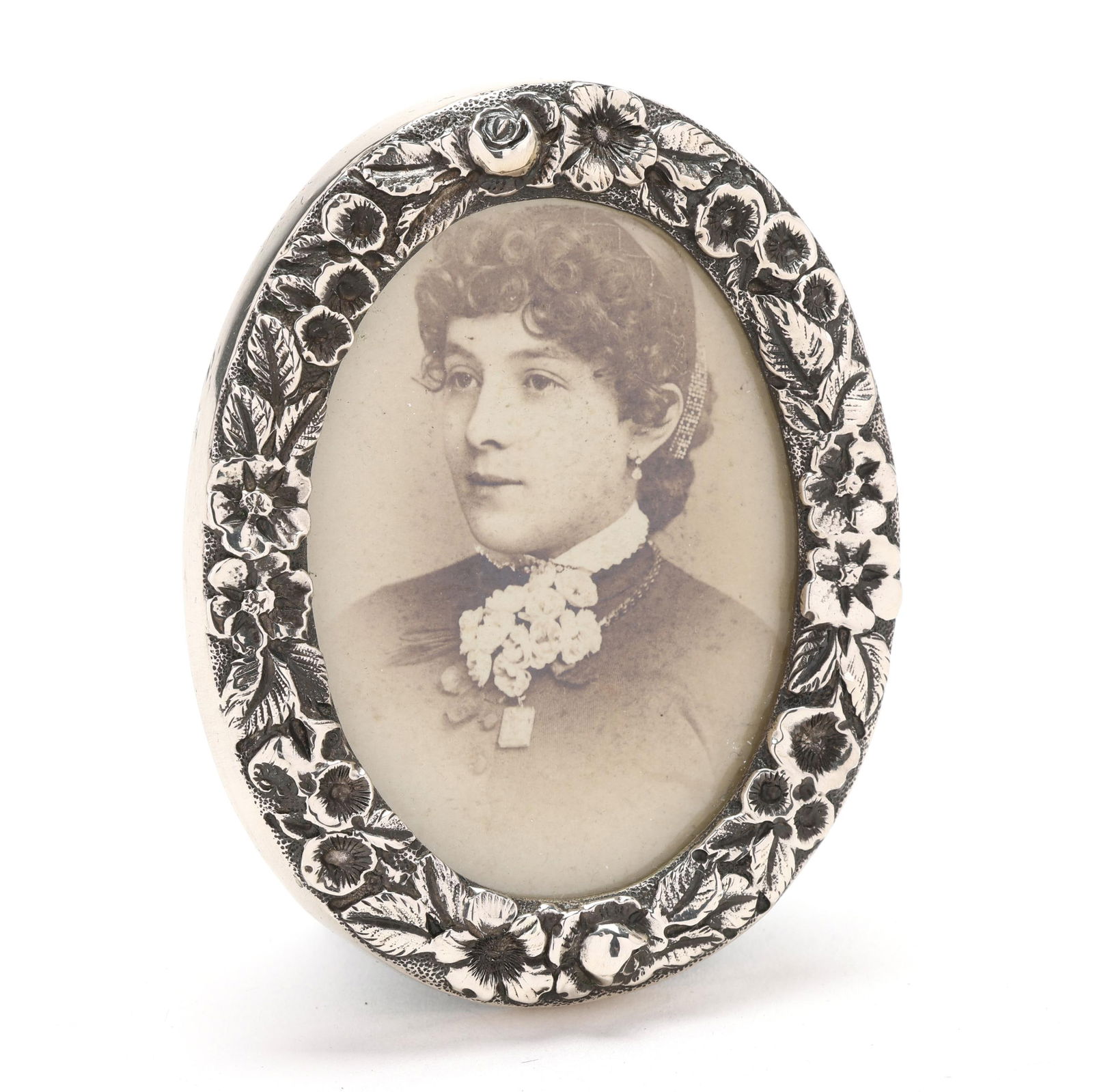 S. Kirk & Son Co. Repousse Sterling Silver Picture Frame: S. Kirk & Son Co. Repousse Sterling Silver Picture Frame circa 1896-1924, pattern number 1C, featuring hand-chased floral decoration and a green velvet backing, not monogrammed. 3 x 2 3/8 in. .55