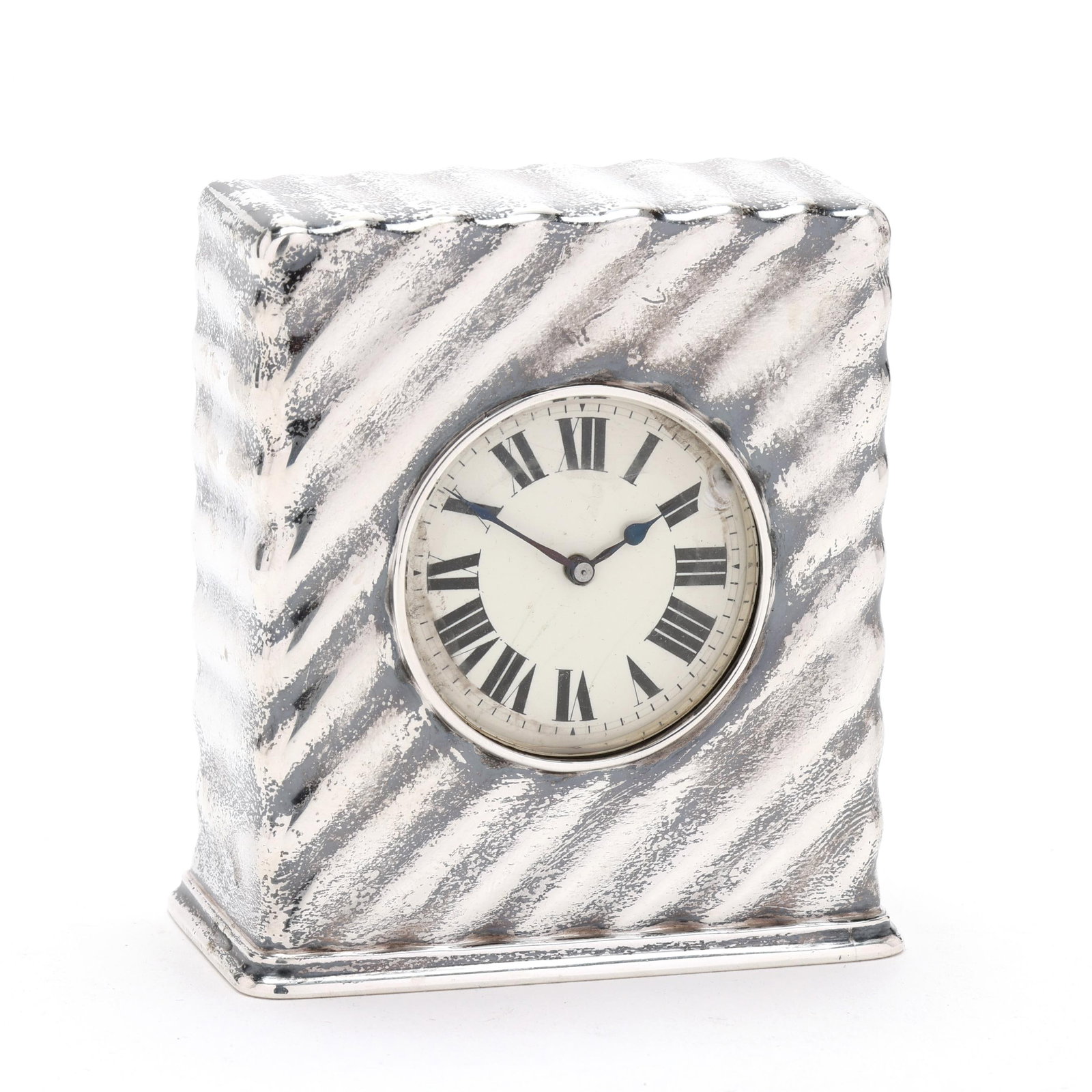 Tiffany & Co. Sterling Silver Desk Clock: Tiffany & Co. Sterling Silver Desk Clockperiod mark circa 1907-1947, directorship of John C. Moore II, with diagonal striations to the case, and a porcelain dial with roman numerals, manual wind movem