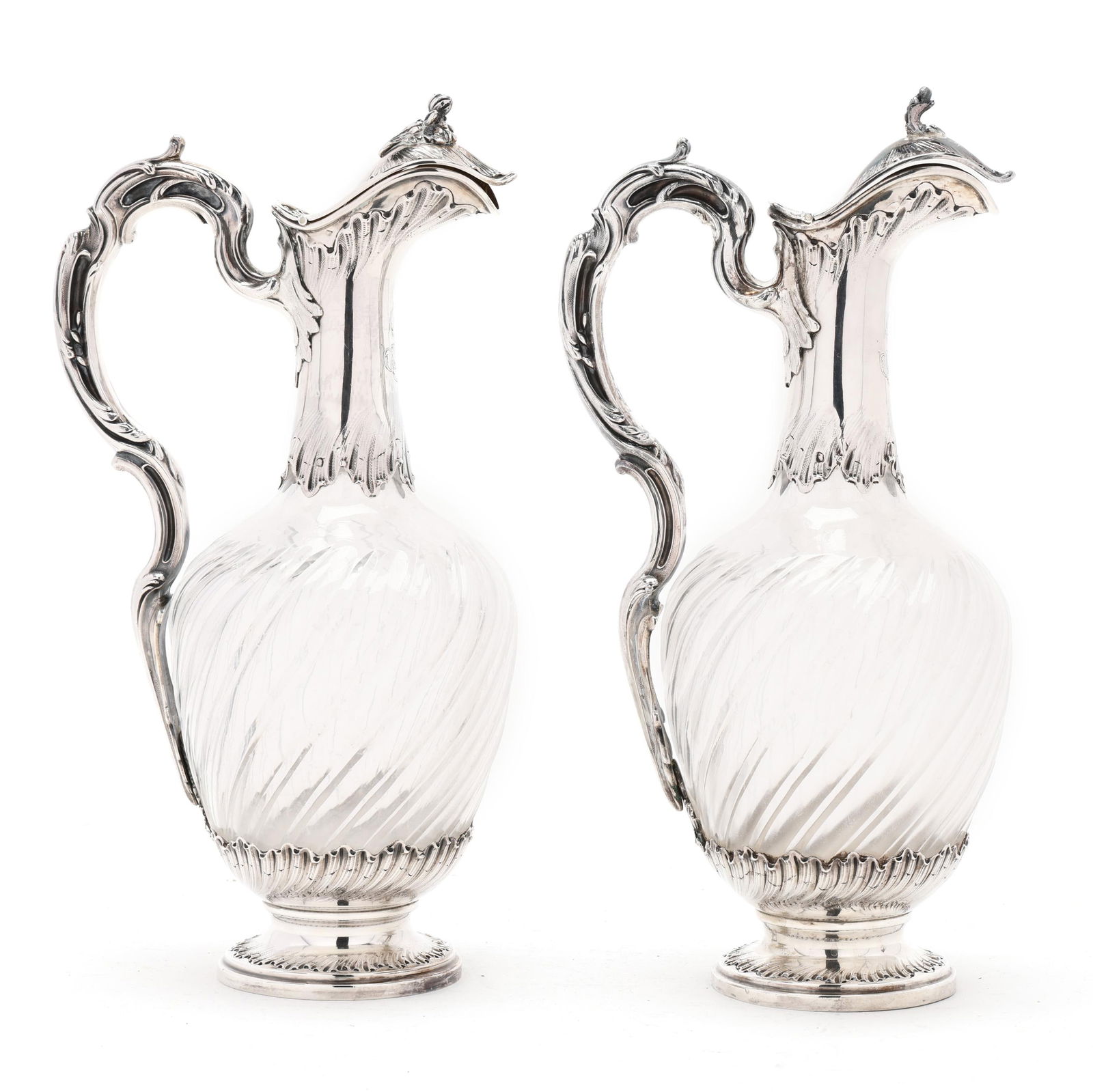 Pair of French Silver Mounted Glass Wine Ewers: Pair of French Silver Mounted Glass Wine Ewers with Minerva mark in the 1st standard, each with an unidentified "A" and star mark within a horizontal lozenge, with hand-chased shell decoration to