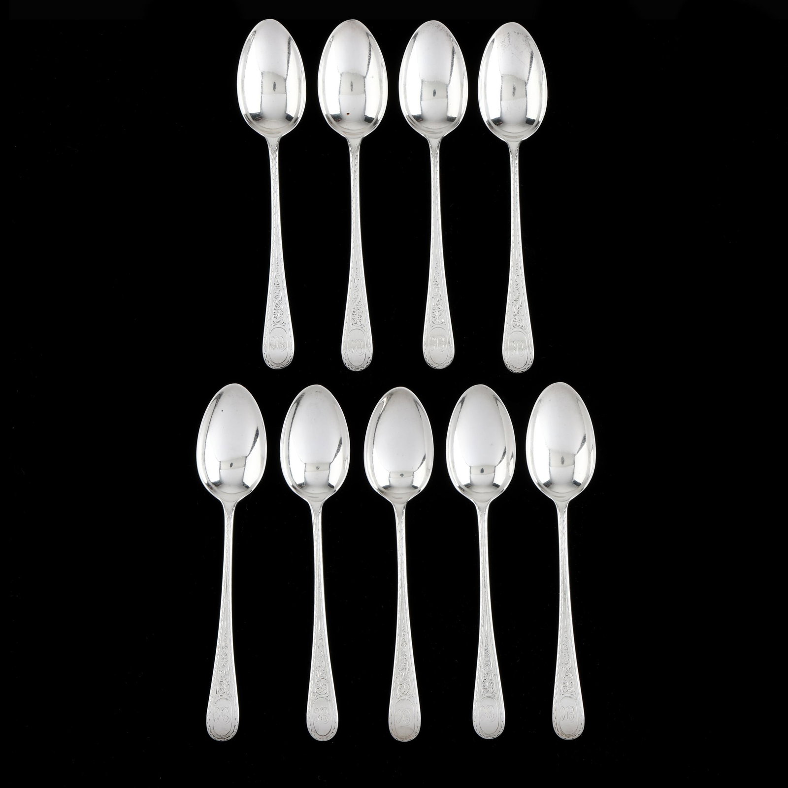 Set of Nine Victorian Scottish Silver Coffee Spoons: Set of Nine Victorian Scottish Silver Coffee Spoons mark of Robert Scott, Glasgow (1880), with allover engraved decoration to the handles and verso bowls, with "EK" monograms. 5 in. 4.2 troy oz. 