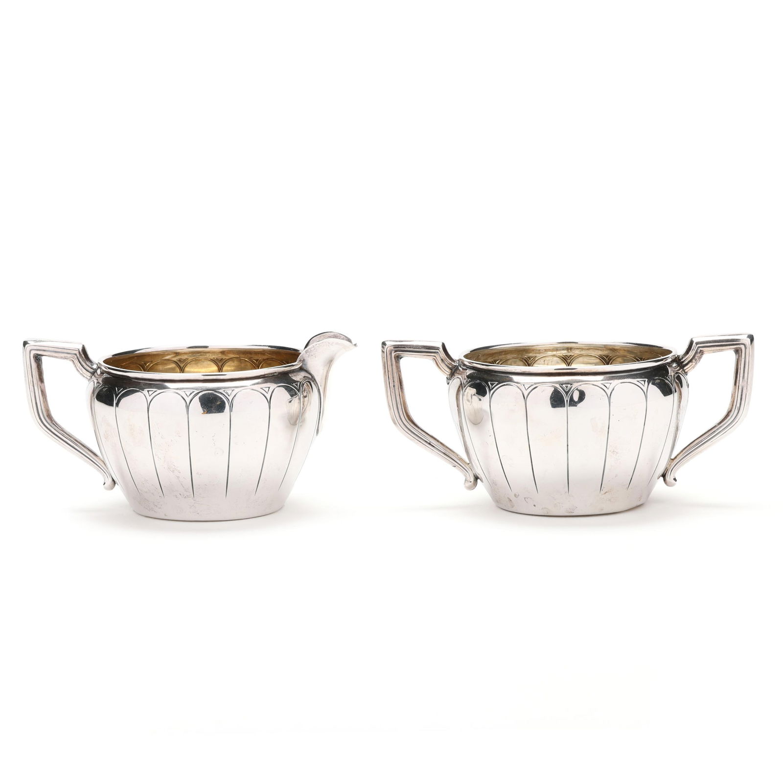 American Sterling Silver Creamer and Sugar Bowl: American Sterling Silver Creamer and Sugar Bowl mark of Ace Co., pattern number 52, with stylized fluting to the bodies, not monogrammed. Each 2 1/4 x 4 3/4 x 3 1/4 in. 3 troy oz. Private