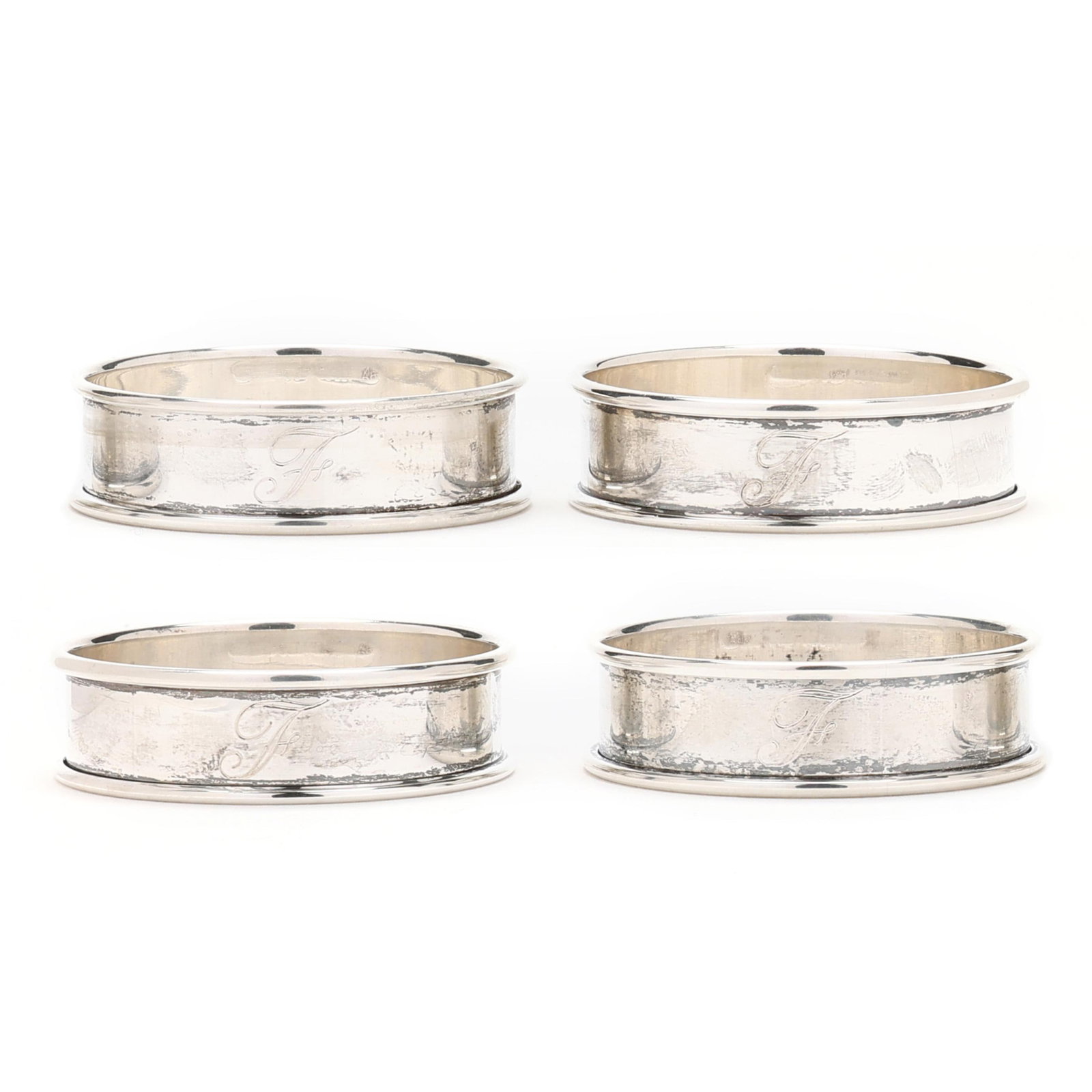 Set of Four Reed & Barton Sterling Silver Napkin Rings: Set of Four Reed & Barton Sterling Silver Napkin Rings late 20th century, with "E" monograms. 1 3/4 in. dia. 1.1 troy oz. Additional high-resolution photos are available at www.lelandlittle.com