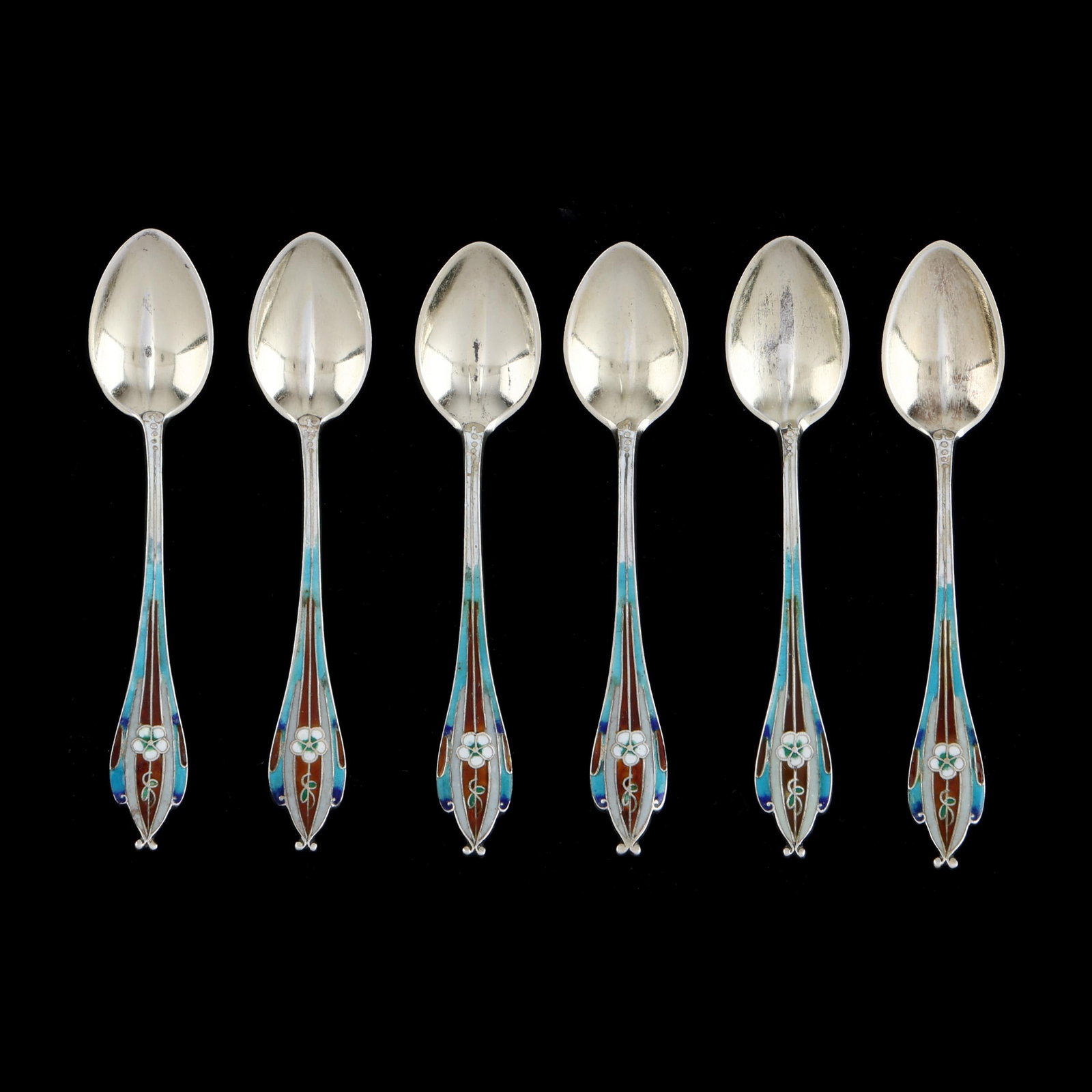 Set of Six Gorham Sterling Silver and Enameled Demitasse Spoons: Set of Six Gorham Sterling Silver and Enameled Demitasse Spoons pattern number 73, featuring gold wash and multicolored enameled pansy and stylized handles, not monogrammed. 3 1/8 in. .9 troy oz.
