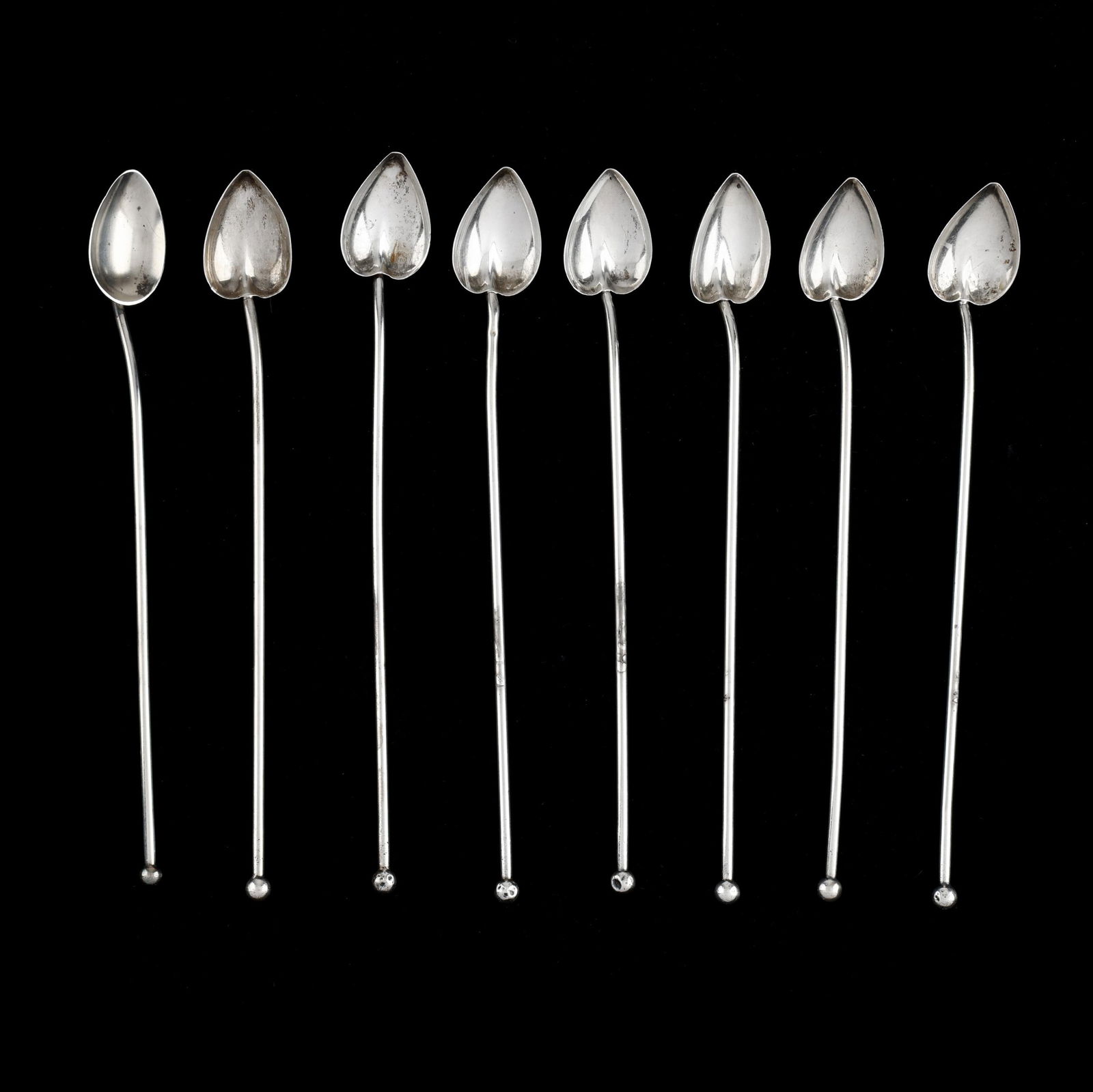 Eight Sterling Silver Stirring Straws: Eight Sterling Silver Stirring Straws most with mark of Watson, featuring heart form bowls and ball finials, not monogrammed. 7 7/8 in. 2.9 total troy oz. Private Collection, Portsmouth,