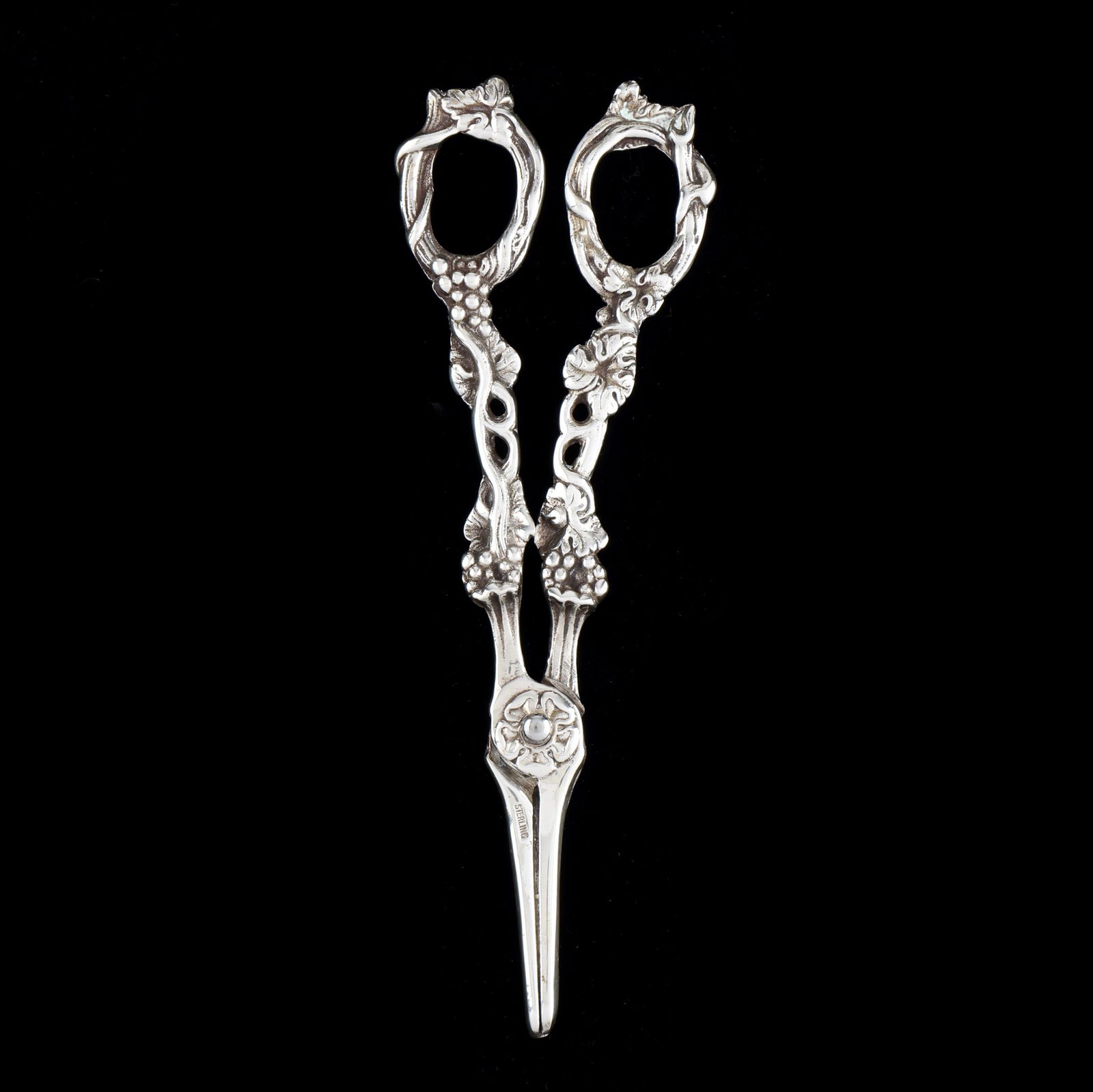Pair of Sterling Silver Grape Shearers: Pair of Sterling Silver Grape Shearers marked "Sterling" to the blade, with grape and vine handles, not monogramed. 6 7/8 x 2 1/2 in. 3.2 troy oz. Additional high-resolution photos are