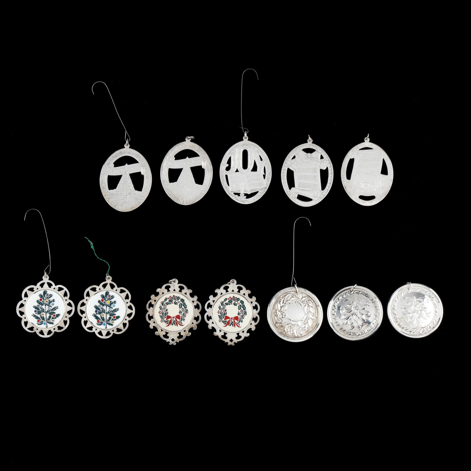 Twelve Lunt Sterling Silver Christmas Medallions: Twelve Lunt Sterling Silver Christmas Medallionscirca 1970s, includes (4) with enameled decoration, all retaining the original boxes, not monogrammed. The largest 2 5/8 in. 7.4 total troy oz. From the