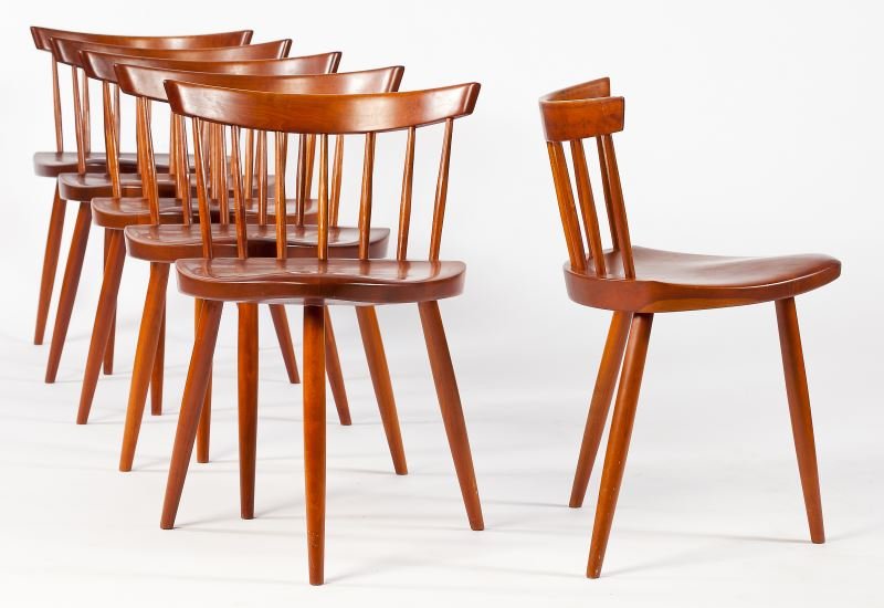 George Nakashima, Six Mira Chairs: George Nakashima, Six Mira Chairs (Japanese-American, 1905-1990), cherry, carved spindle backs, triangular form plank seats, ink signed "Knapp 17" to underside. 26.5 x 17 x 16.25 in. Sold with a copy 