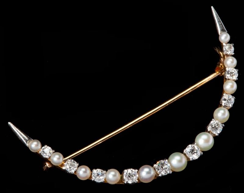 Victorian Diamond and Pearl Crescent Brooch: Victorian Diamond and Pearl Crescent Brooch alternately set with Old European cut diamonds weighing approximately .40 total carat with VS-SI1 clarity and I color and seed pearls set in an 18KT yellow 