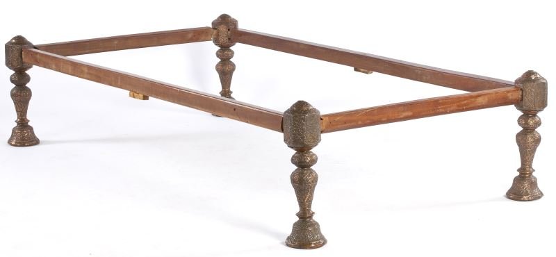 Anglo-Indian Campaign Bed: Anglo-Indian Campaign Bed 19th century, the four-piece wooden frame inserts into baluster posts which are sheathed with highly decorative embossed copper, all easily disassembled. 18 x 79 x 43 in. Est