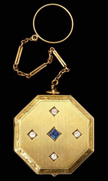 Gold, Diamond and Sapphire Compact, Tiffany & Co.: Gold, Diamond and Sapphire Compact, Tiffany & Co.a gold vintage compact of octagonal form having hinged lid accented with (4) diamond melee and centered with a square cut sapphire. The interior fitted