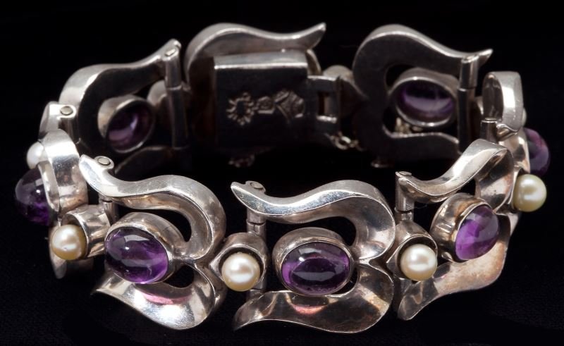 Gem Set Sterling Bracelet, Antonio Pineda: Gem Set Sterling Bracelet, Antonio Pineda Mexican, circa 1940, designed as a bracelet composed of curved stylized links, each set with an oval amethyst cabochon measuring on average approximately 8 x 