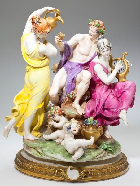 Large Capodimonte Porcelain Figural Group: Large Capodimonte Porcelain Figural Groupcirca 1960, light-hearted classically inspired portrayal of revelries during the grape harvest, the porcelain group raised on a circular gilt metal base, Capod