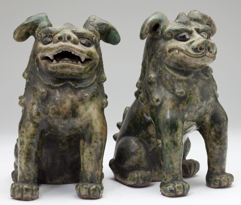 Pair of Chinese Terracotta Foo Dogs: Pair of Chinese Terracotta Foo Dogs unmarked, allover mottled green glaze simulates jade. 10 in. Estate of Marion Ott, Yokosuka and Yokohama, Japan