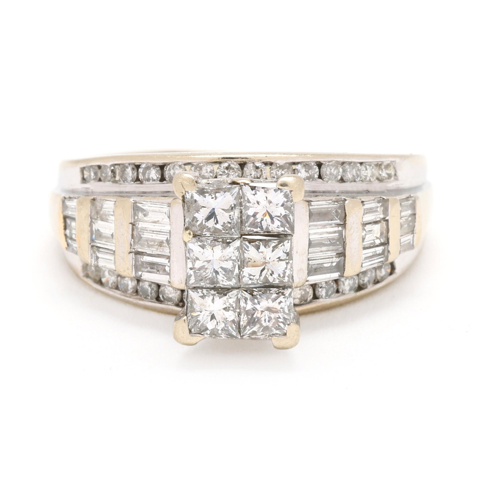 Bi-Color Gold and Diamond Ring: Bi-Color Gold and Diamond Ringset to the center with a cluster of princess cut diamonds weighing approximately .78 total carat (I-J color, I1 clarity), the shoulders and joined band with baguette cut