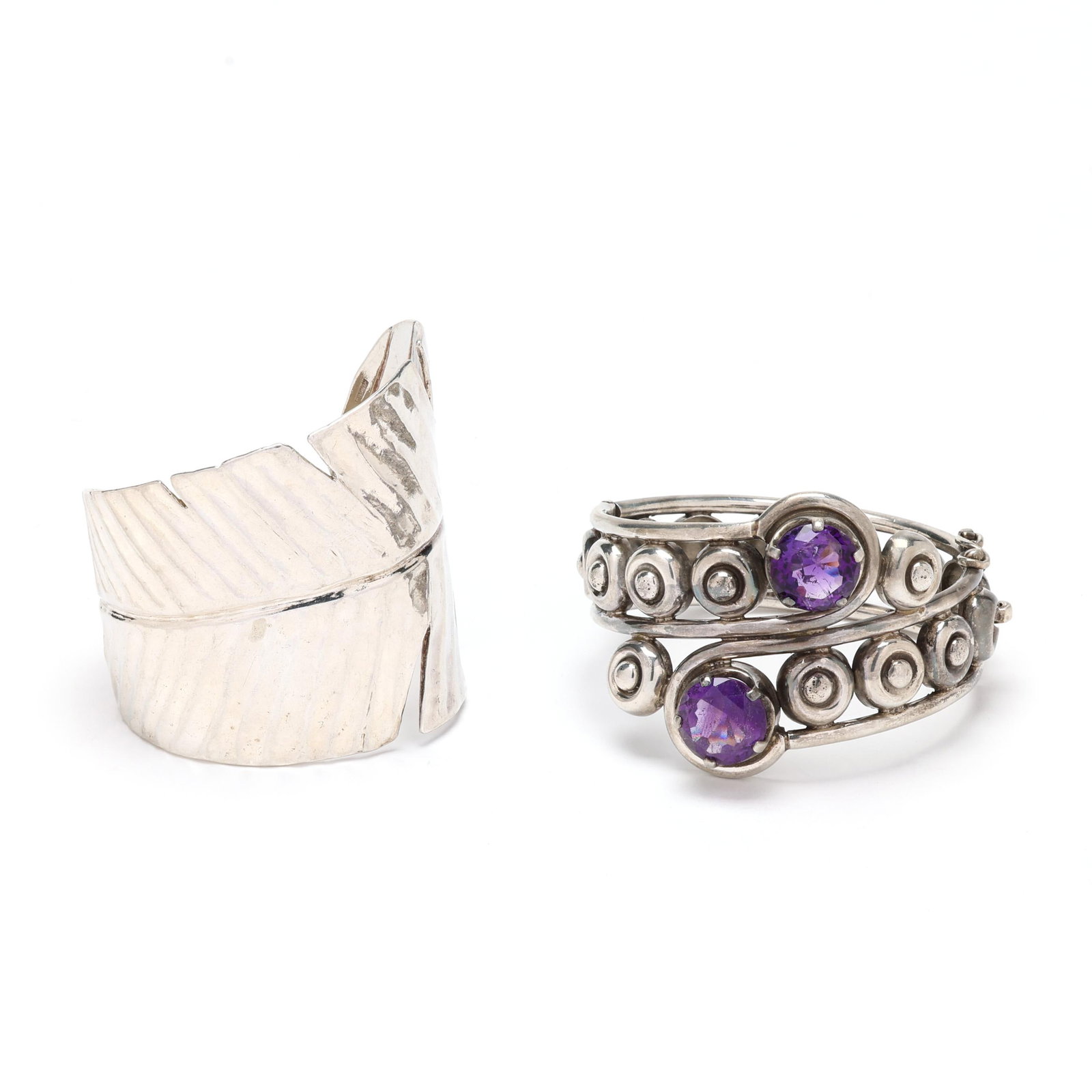 Two Vintage Silver Bracelets, signed: Two Vintage Silver Bracelets, signedto include: a Talleres De Los Ballesteros silver bracelet with crossover design and set with two round cut amethysts (13.5mm), completed with an integrated clasp wi