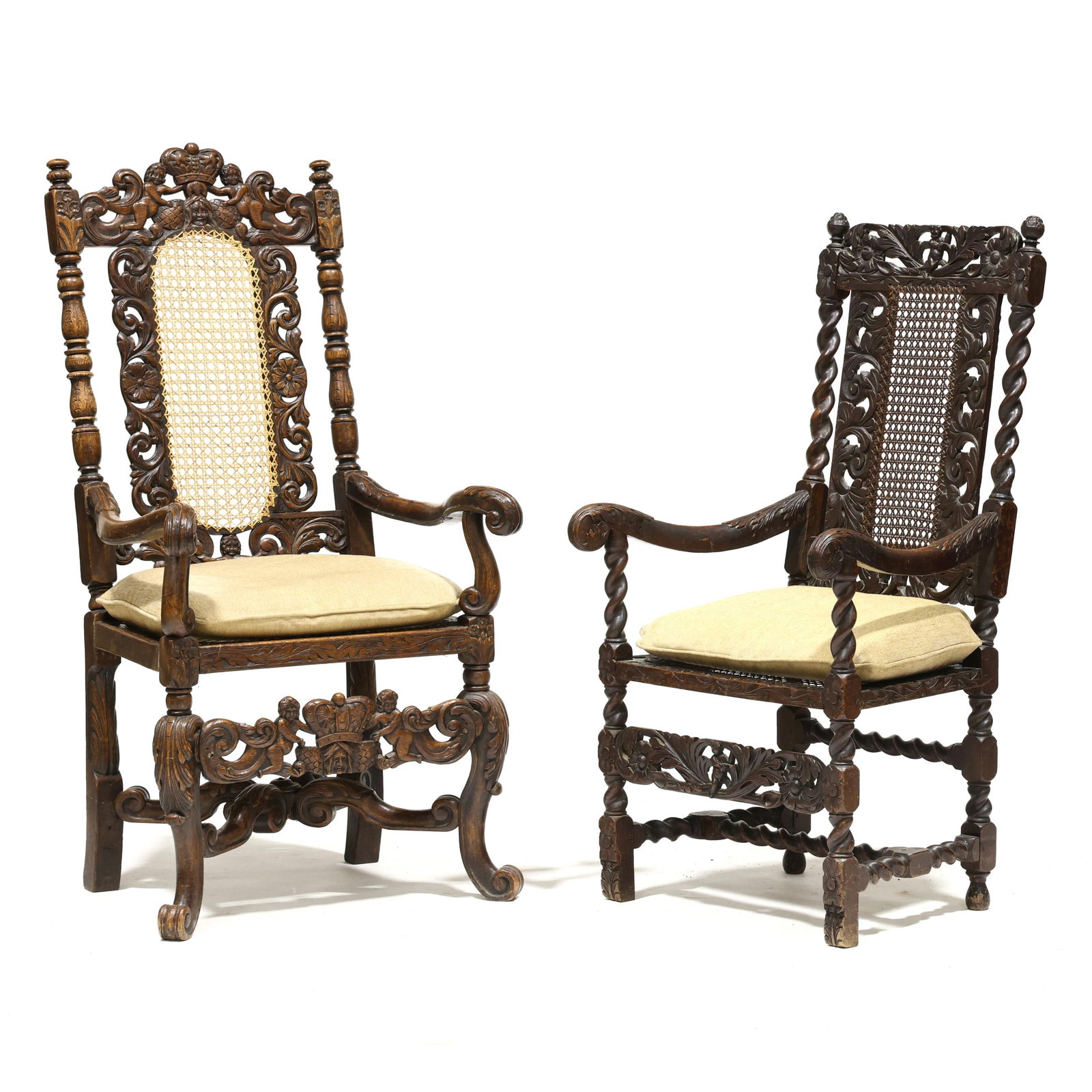 Two Jacobean Style Carved Oak Hall Chairs: Two Jacobean Style Carved Oak Hall Chairslate 19th century, each with figural relief carving, cane back and seats, shaped arms with acanthus leaf knuckles, pierced carved front stretchers with stretch