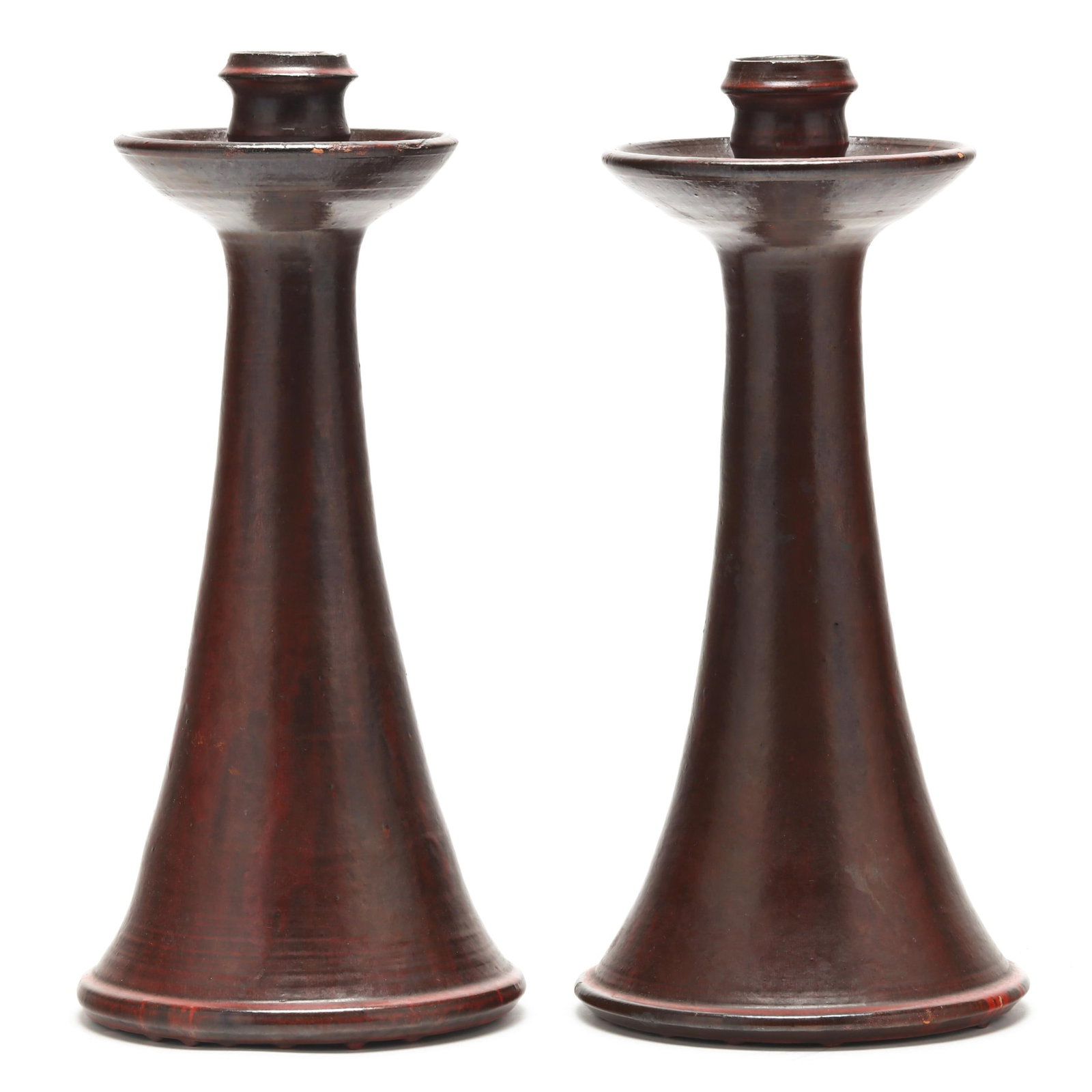Charles Boyd Craven (Randolph County, NC, 1909-1991), Pair of Pottery Candlesticks: Charles Boyd Craven (Randolph County, NC, 1909-1991), Pair of Pottery Candlesticksfor Teagues Pottery (Seagrove, NC), mid- to late 20th century, terracotta in deep red matte glaze, both stamped "C.B.