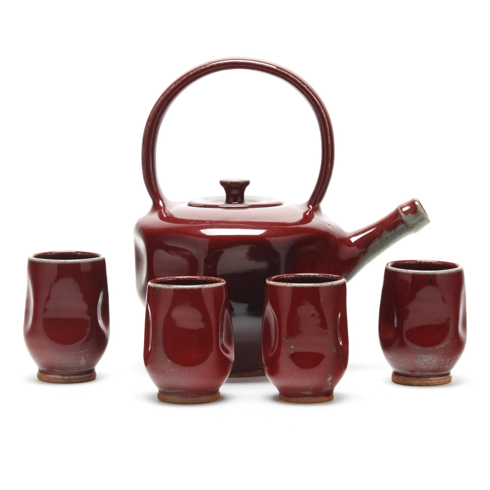 Ben Owen III (Seagrove, NC), Cabernet Glazed Pottery Tea Set for Four: Ben Owen III (Seagrove, NC), Cabernet Glazed Pottery Tea Set for Four2003, pinched stoneware forms in cabernet glaze, including a lidded teapot with loop handle (10 x 9 3/4 x 6 1/2 in.); and (4) cups