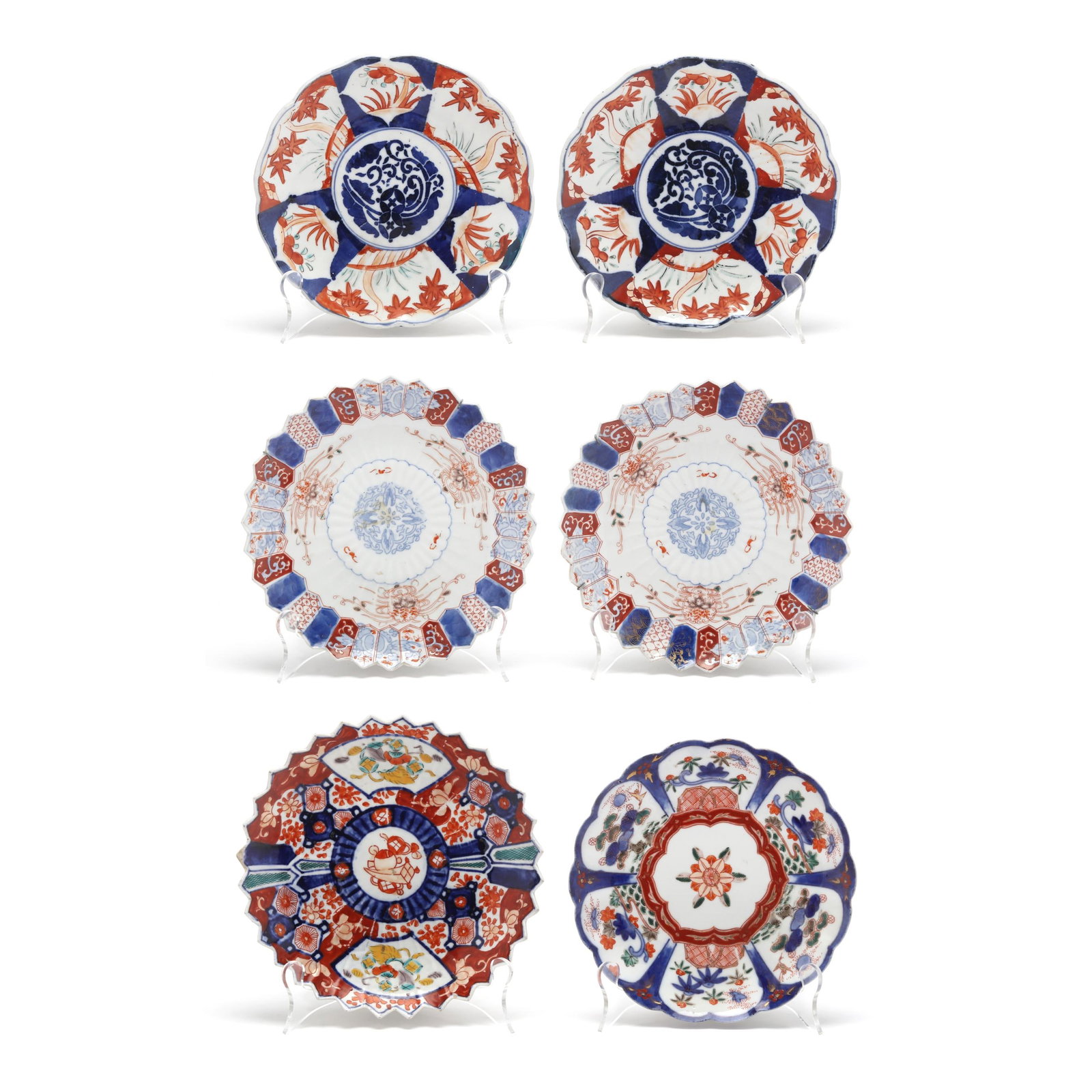 A Group of Six Japanese Imari Porcelain Plates: A Group of Six Japanese Imari Porcelain Plates Meiji period (1868-1912), late 19th century, porcelain decorated in the Imari palette of iron red, underglaze cobalt blue, and gilt accents, the exterior