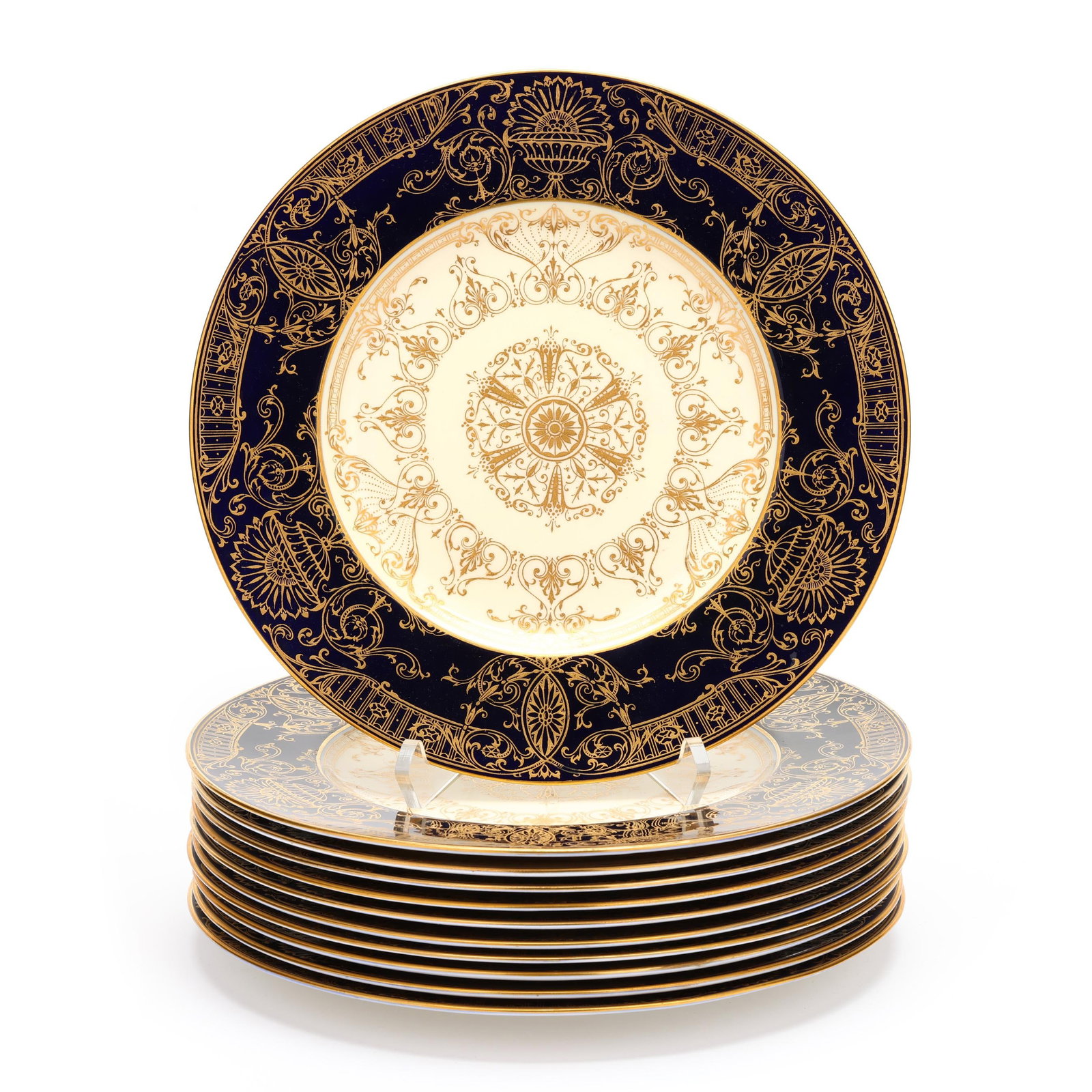Royal Worcester, Eleven Cobalt and Gilt Dinner Plates: Royal Worcester, Eleven Cobalt and Gilt Dinner Plates made in England, circa 1935 date marks with company backstamps to the reverse, decorated in Neoclassical gilt foliate and urn filigree tracery.
