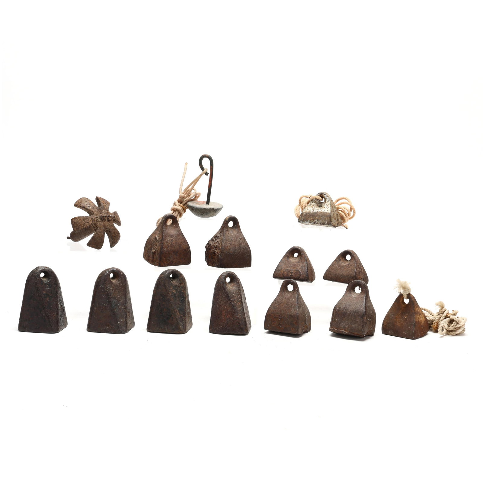 A Collection of Early North Carolina Anchor Weights: A Collection of Early North Carolina Anchor Weights Cast iron wrights from the Sanders Foundry in North Carolina, and a couple of sand cast lead weights. Box: 9 x 15 x 9.5in. ; Largest weight 4 x 3.5 