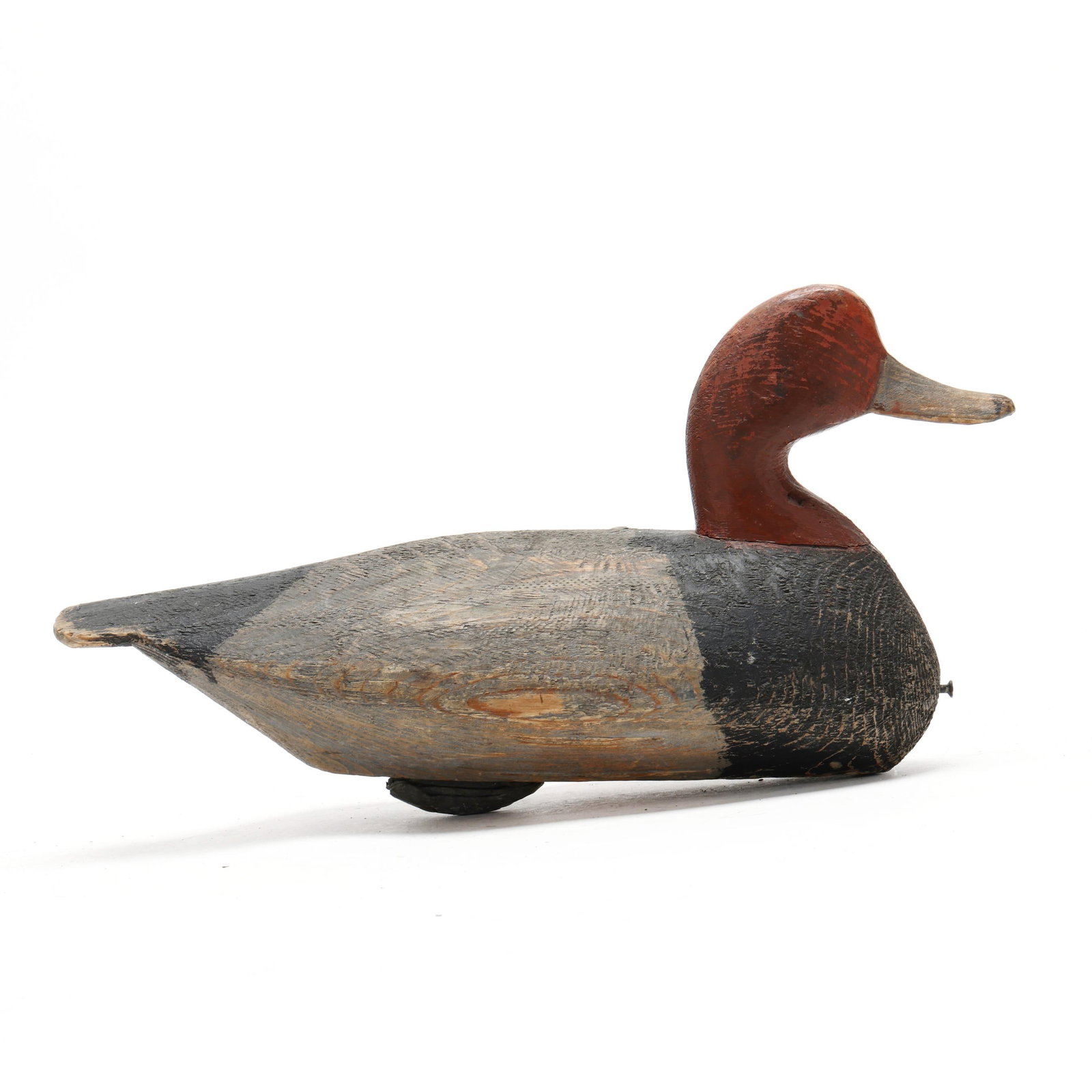Ned Burgess ( NC, 1868-1958), Redhead: Ned Burgess ( NC, 1868-1958), Redhead Churches Island, North Carolina, circa 1930s, carved and painted wood. Length 16 in. This diminutive redhead was carved from the heartwood of a small log. From th