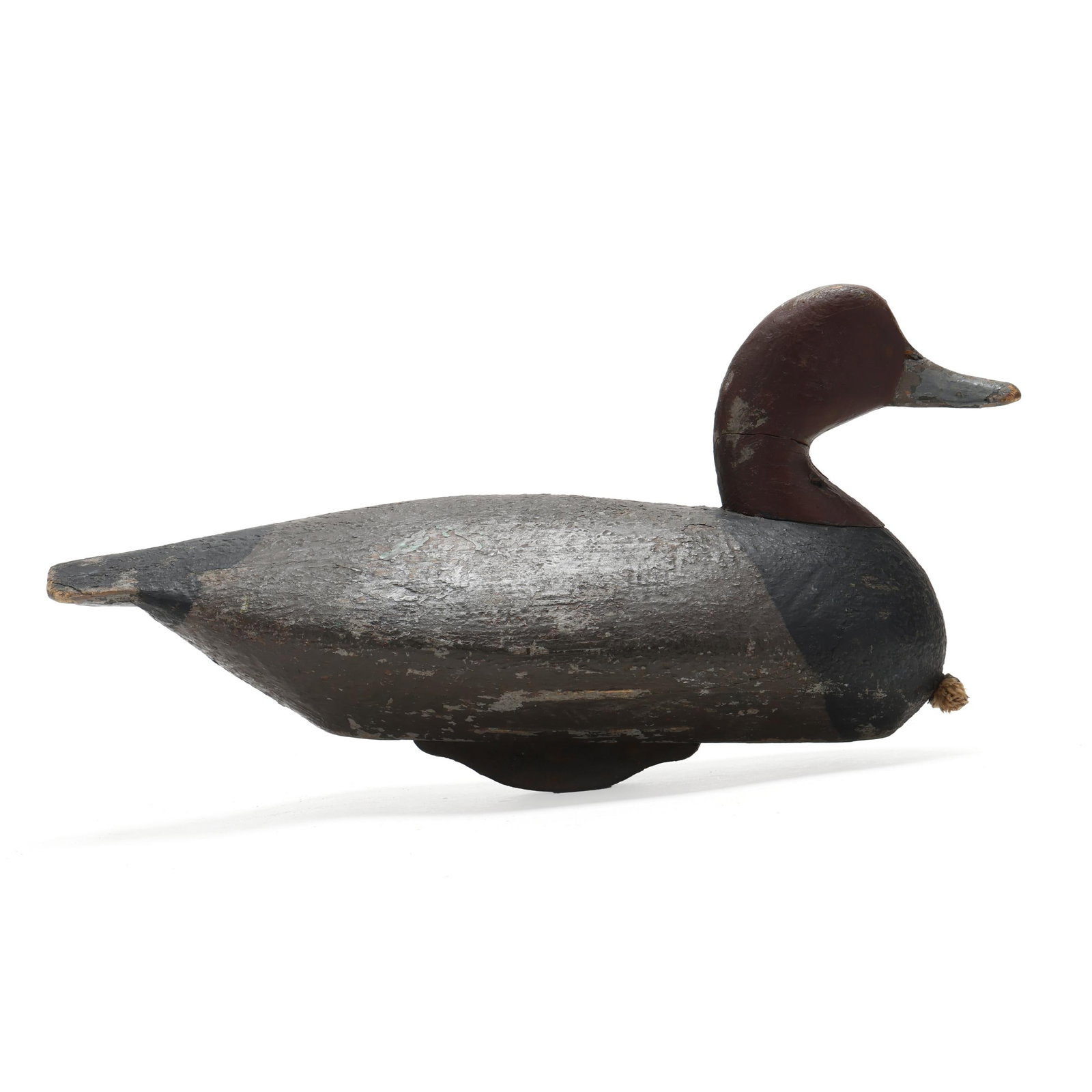 Ned Burgess ( NC, 1868-1958), Redhead: Ned Burgess ( NC, 1868-1958), Redhead Churches Island, North Carolina, circa 1930s, carved and painted wood. Length 16.5 in. x 8.5 x 6.5 A very pleasing form with the slightly winded head and drop dow
