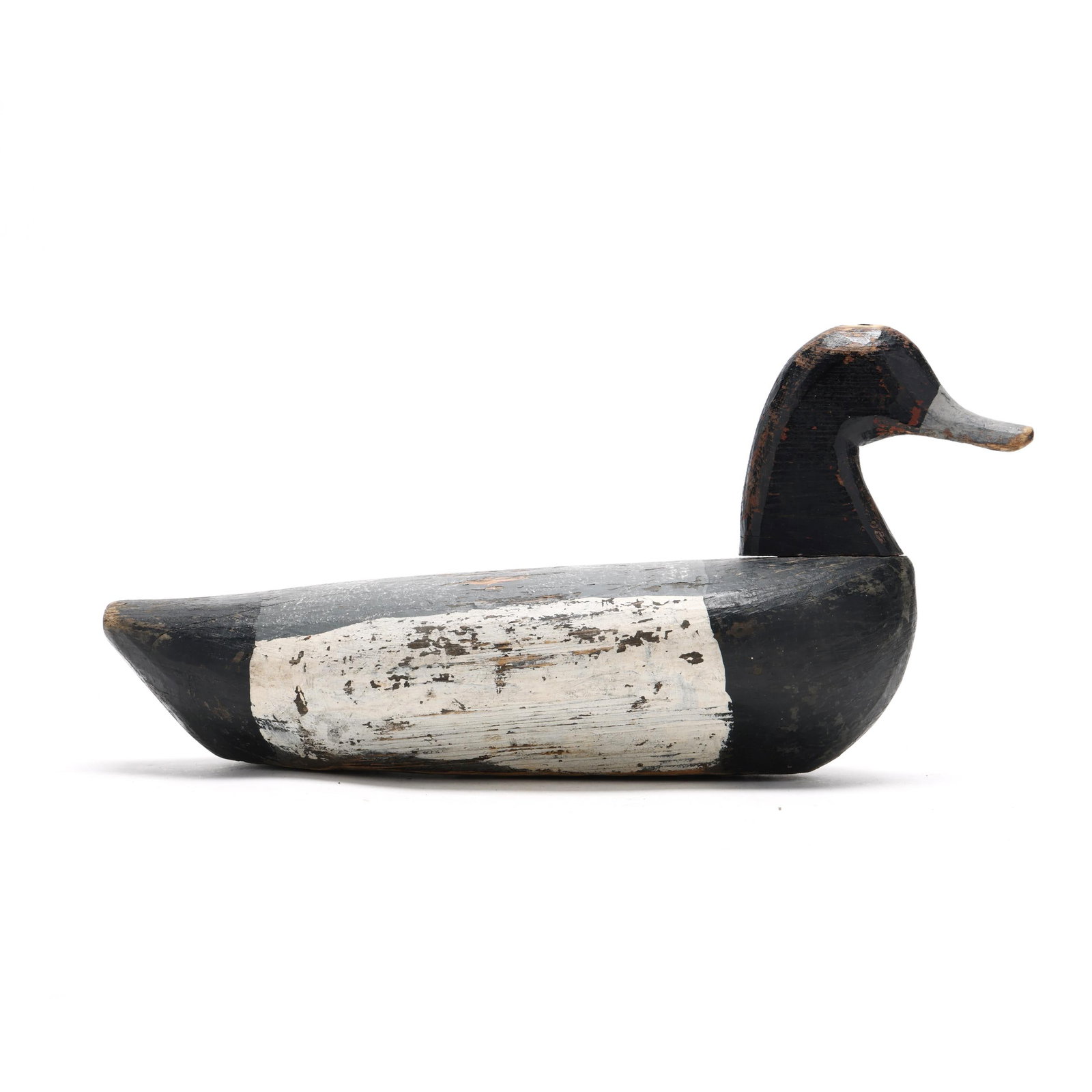 Aaron Hooper (NC, 1874-1959), Redhead: Aaron Hooper (NC, 1874-1959), Redhead Salvo, North Carolina, circa 1900, carved and painted wood. Length 18.5 in. x 9.5 x 7 An early market hunting decoy. Shortly after 1916, Hooper sold his market hu