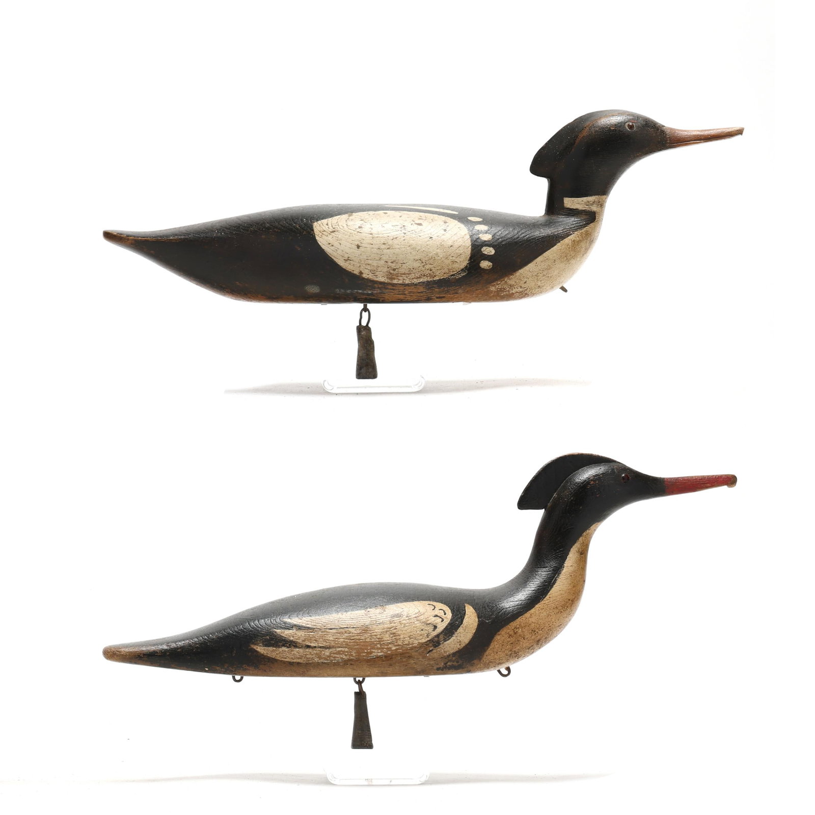 Pair of Early Nova Scotia Mergangers: Pair of Early Nova Scotia Mergangers Nova Scotia, Canada, circa 1920s, carved and painted wood, glass eyes, each has a swinging lead ballast. Length 18.5 in. x 6 x 6 each. Extremely well crafted in a 