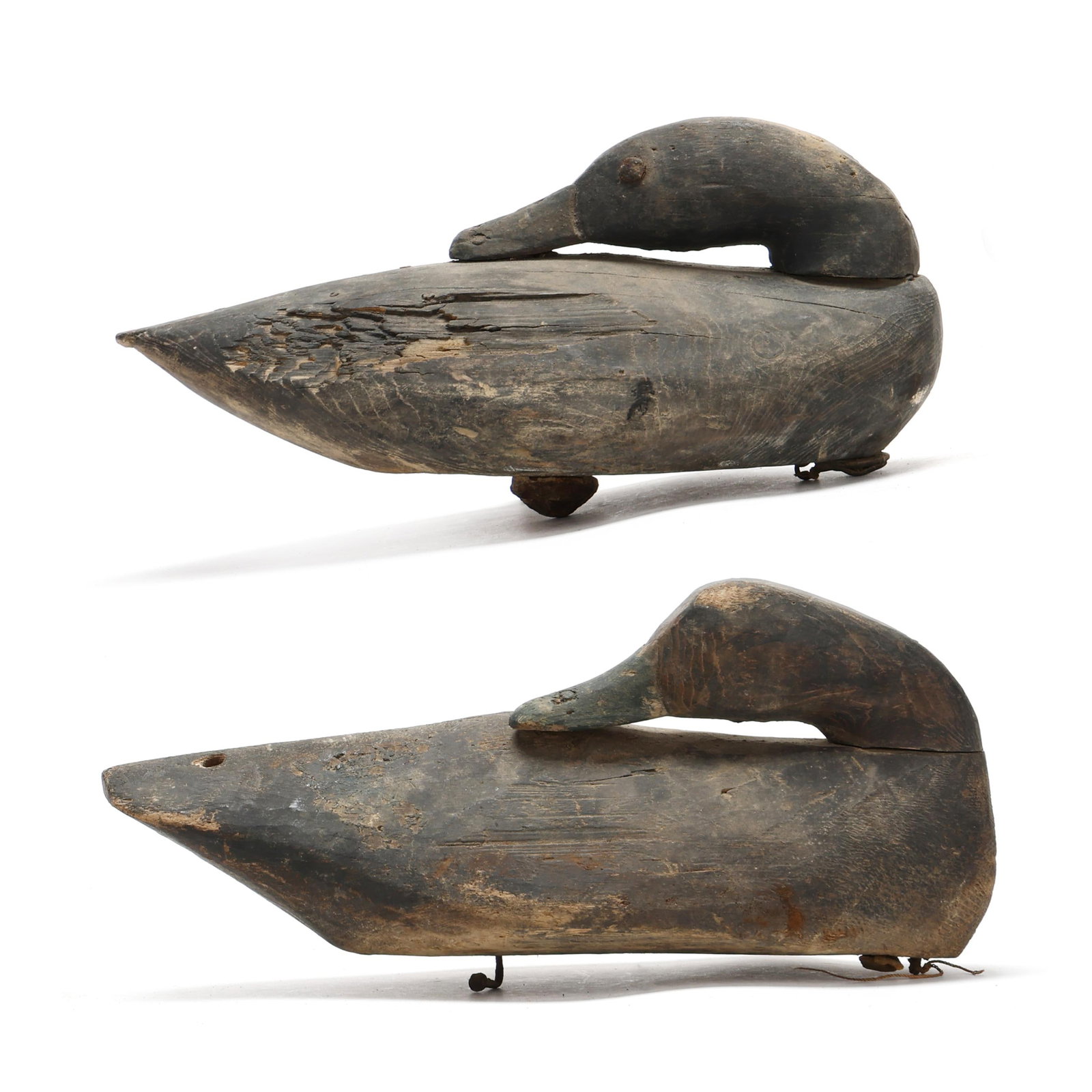 Two Early Long Island Preening Black Ducks: Two Early Long Island Preening Black Ducks Long Island, New York, circa 1910, carved and painted wood, one has tack eyes. Length 14.5 in. x 7 x 7.5 Additional high-resolution photos are available at w