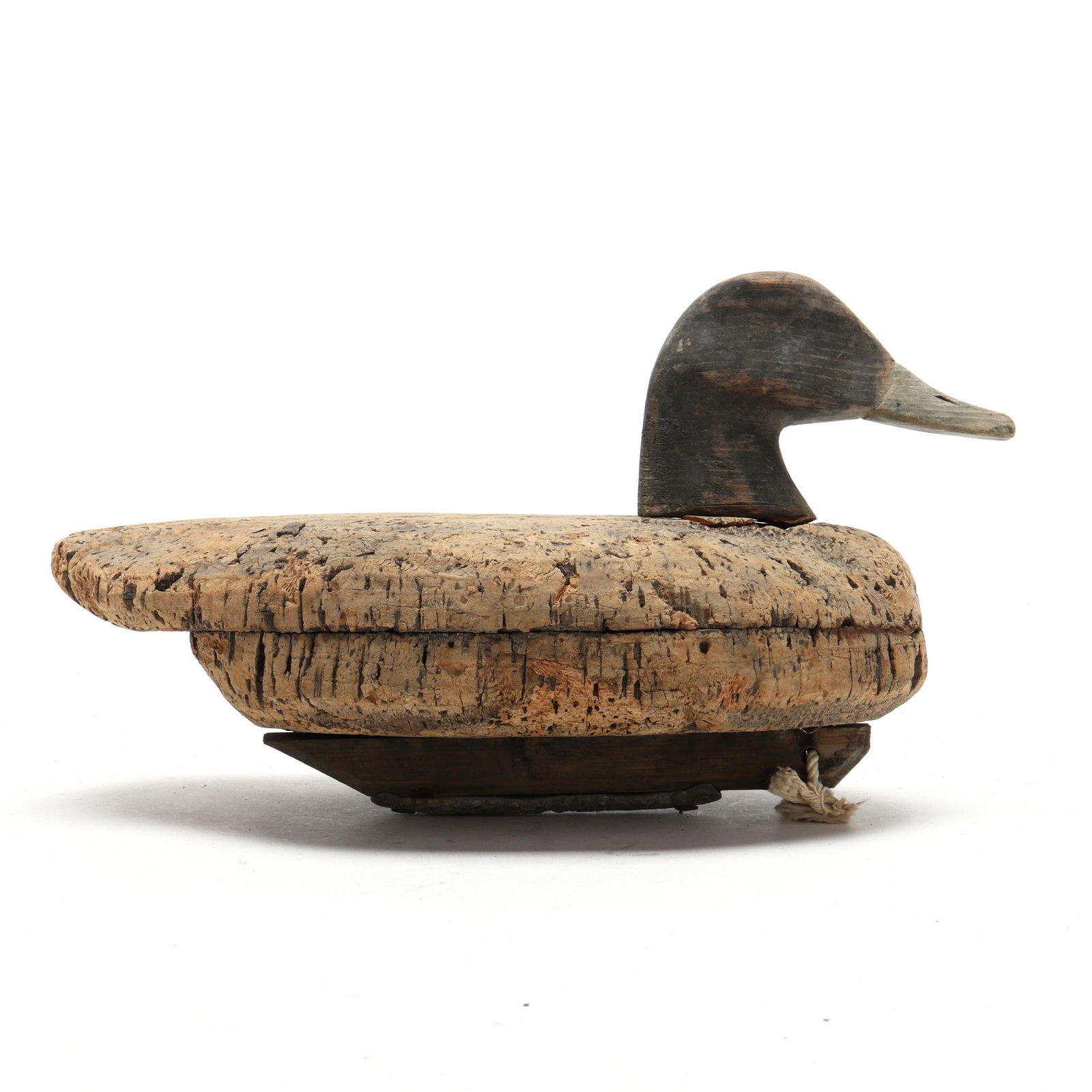 Currituck Shooting Club Canvasback: Currituck Shooting Club Canvasback Long Island, New York, circa 1900, carved and painted cork and wood, wood keel. Length 13.5 in. x 8 x 7 Two piece cork body joined by wooden pegs. Additional high-re