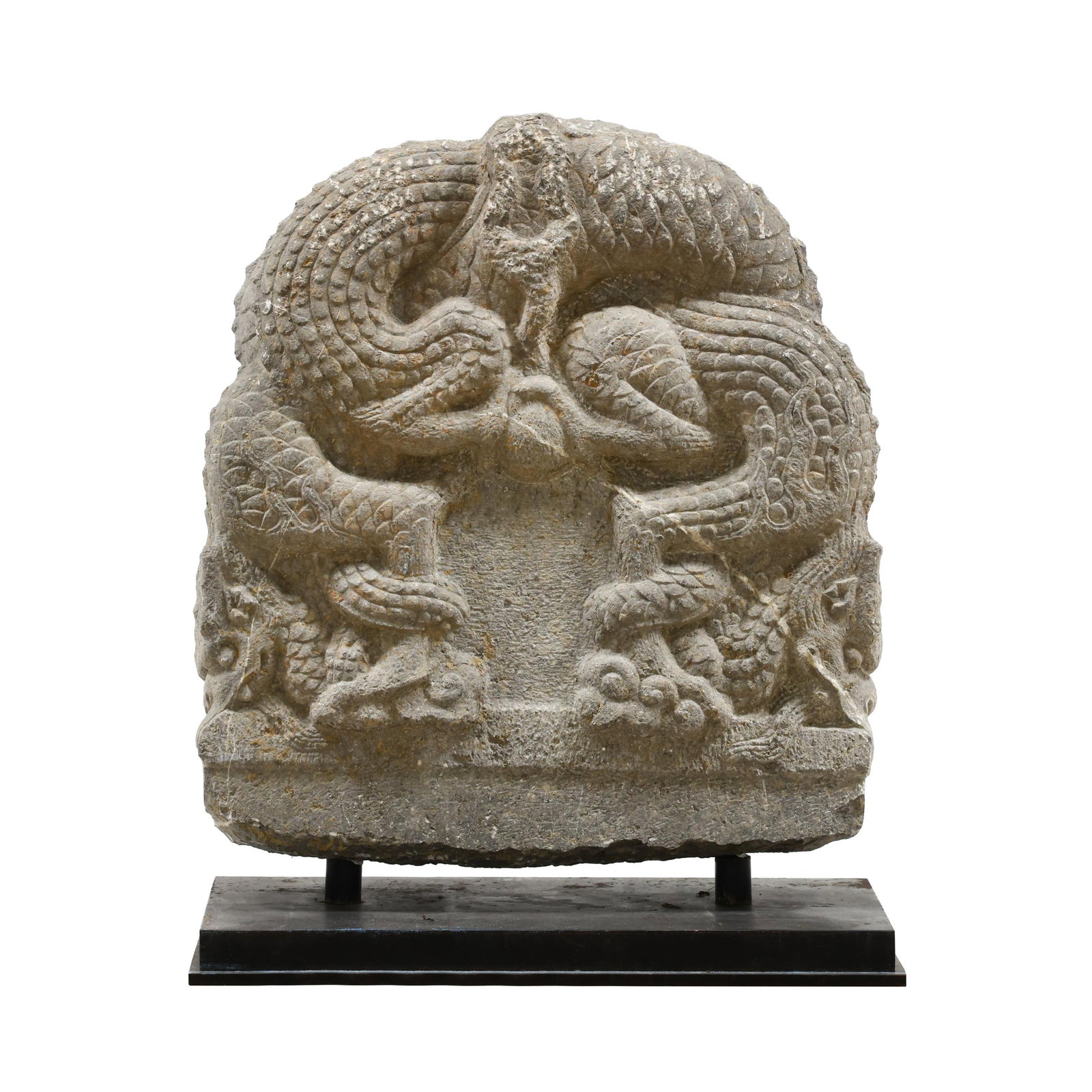 A Monumental Chinese Carved Stone Dragonhead Stele: A Monumental Chinese Carved Stone Dragonhead Stele probably late Ming or early Qing dynasty, carved limestone, depicting two intertwined dragons clutching a central orb at center, one side incised wit