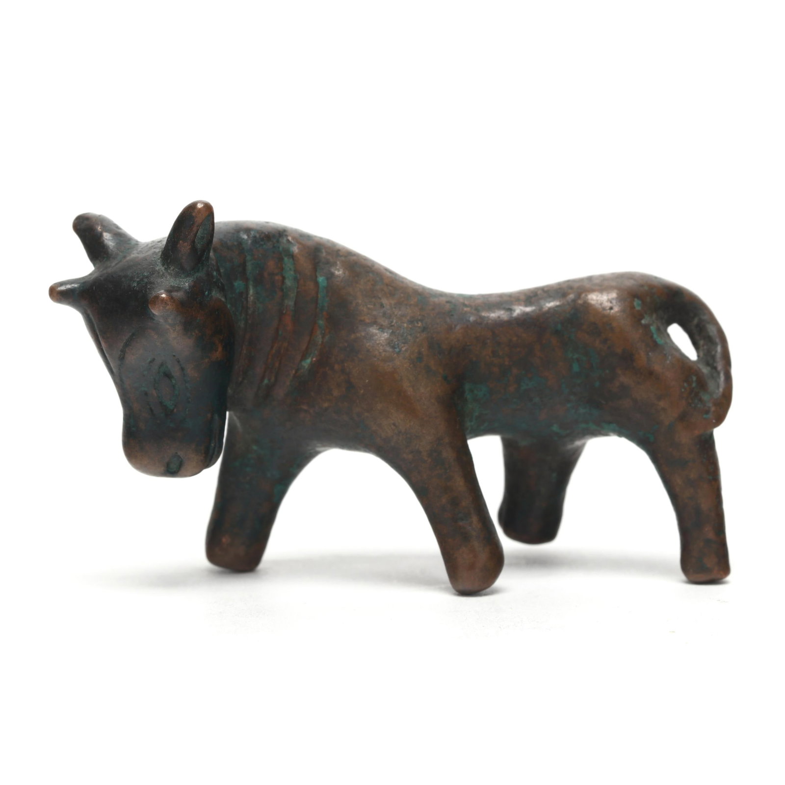 A Chinese Archaic Bronze Bull: A Chinese Archaic Bronze Bull Warring States period or style, cast bronze bull posed in a walking position, its head pointed downwards, its almond eyes, nose, and mouth are rendered in archaic style, 
