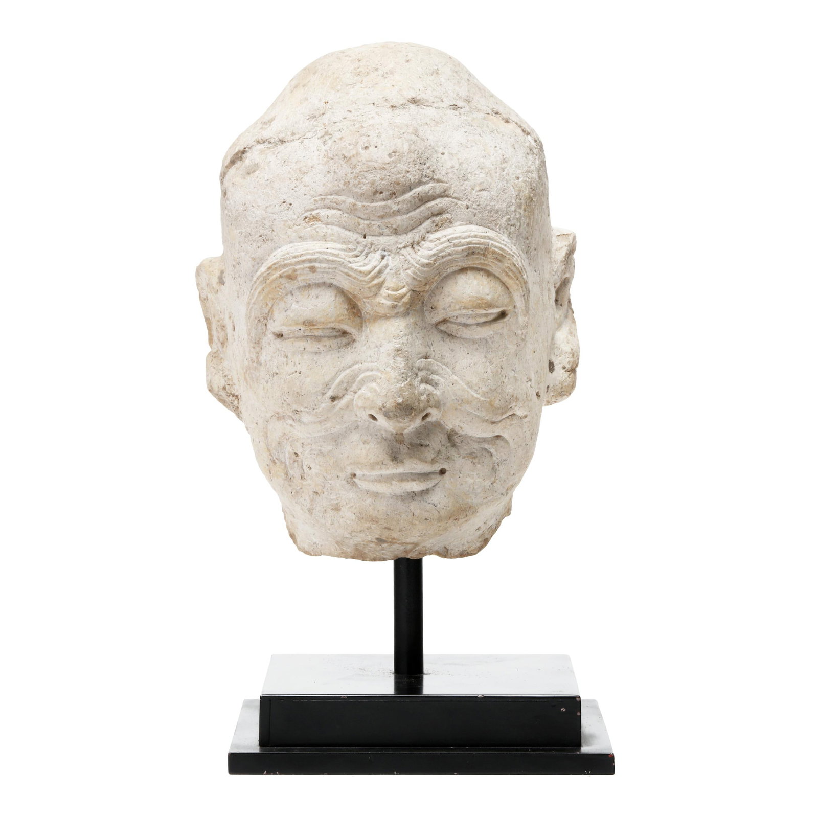 A Chinese Carved Limestone Head of a Luohan: A Chinese Carved Limestone Head of a Luohan Song dynasty (960-1279), limestone finely carved head, sharply arched and full eyebrows above narrow half-closed eyes, a scrolling moustache issuing from th
